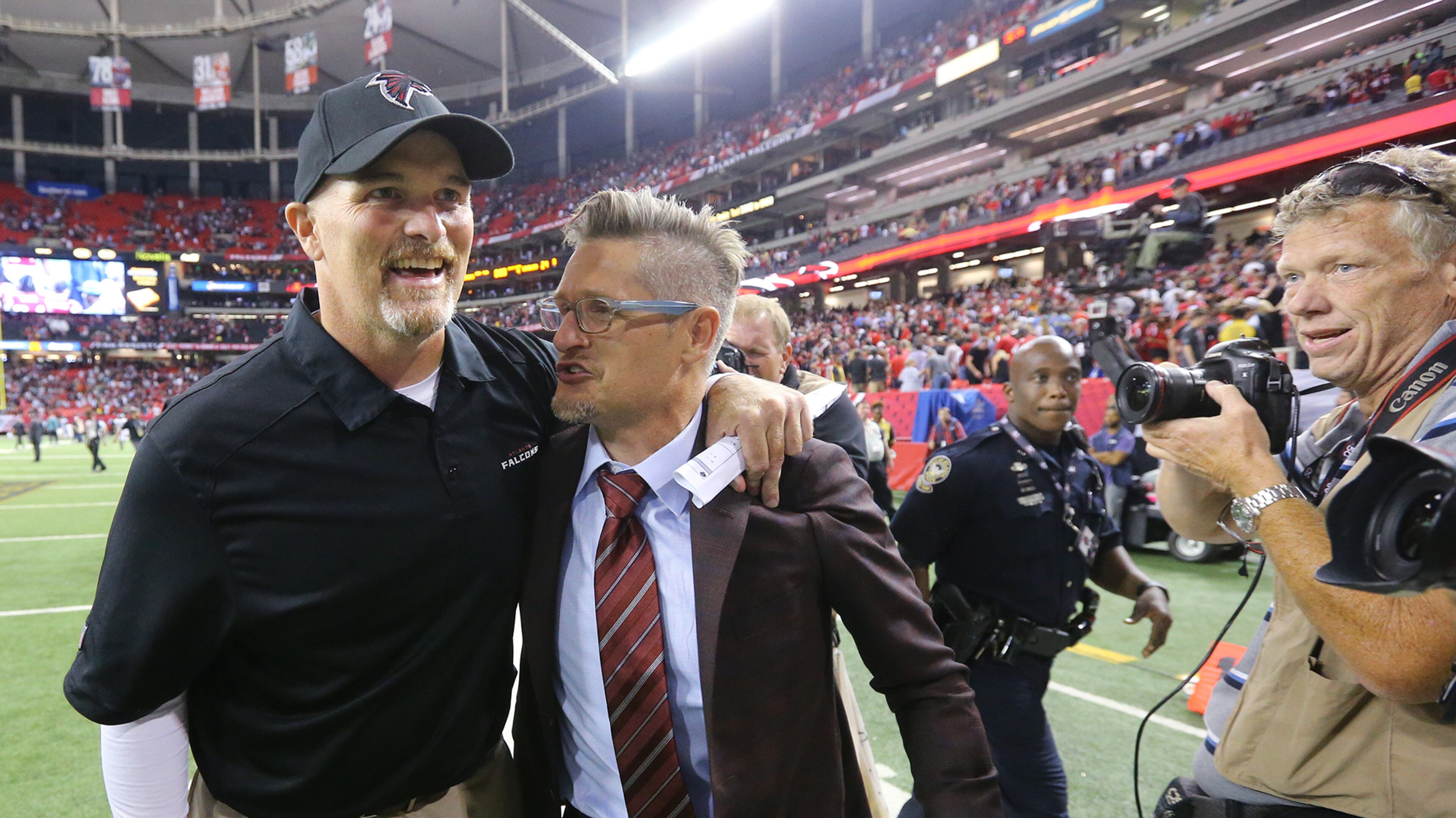 091415 ATLANTA: Falcons head coach Dan Quinn celebrates winning his first NFL game as a head coach with General Manager Thomas Dimitroff after beating the Eagles 26-24 during their Monday Night Football game on Monday, Sept. 14, 2015, in Atlanta. Curtis Compton / ccompton@ajc.com