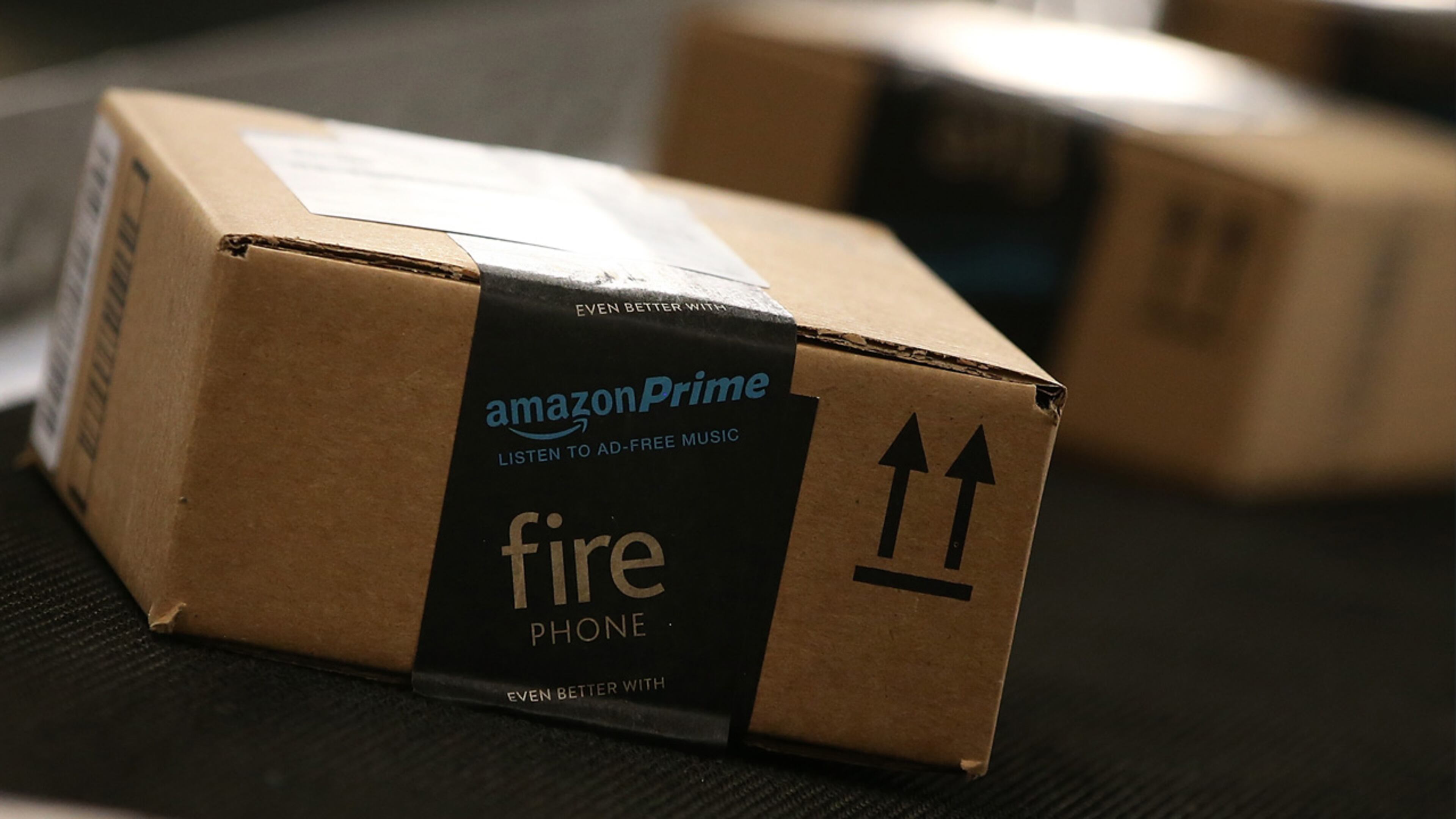 Boxes move along a conveyor belt at an Amazon fulfillment center on January 20, 2015 in Tracy, California.