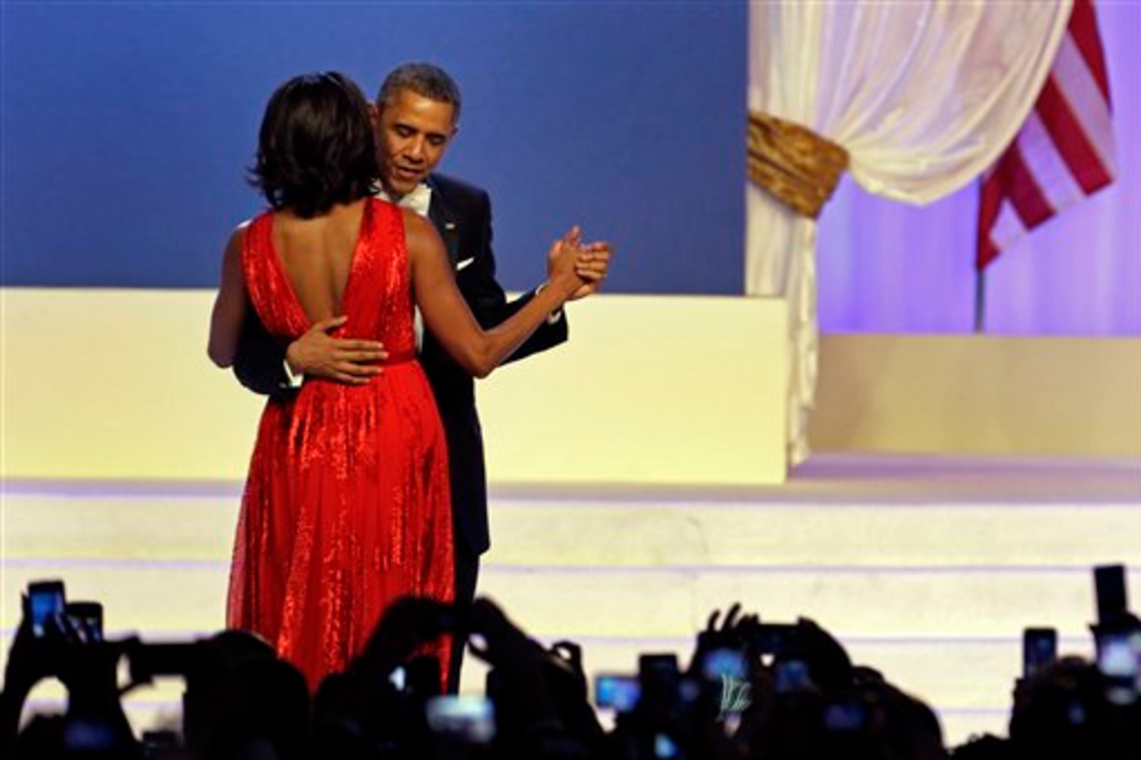 President Barack Obama and first lady Michelle Obama dance during The Inaugural Ball at the Washignton convention center during the 57th Presidential Inauguration in Washington, Monday, Jan. 21, 2013. (AP Photo/Paul Sancya)