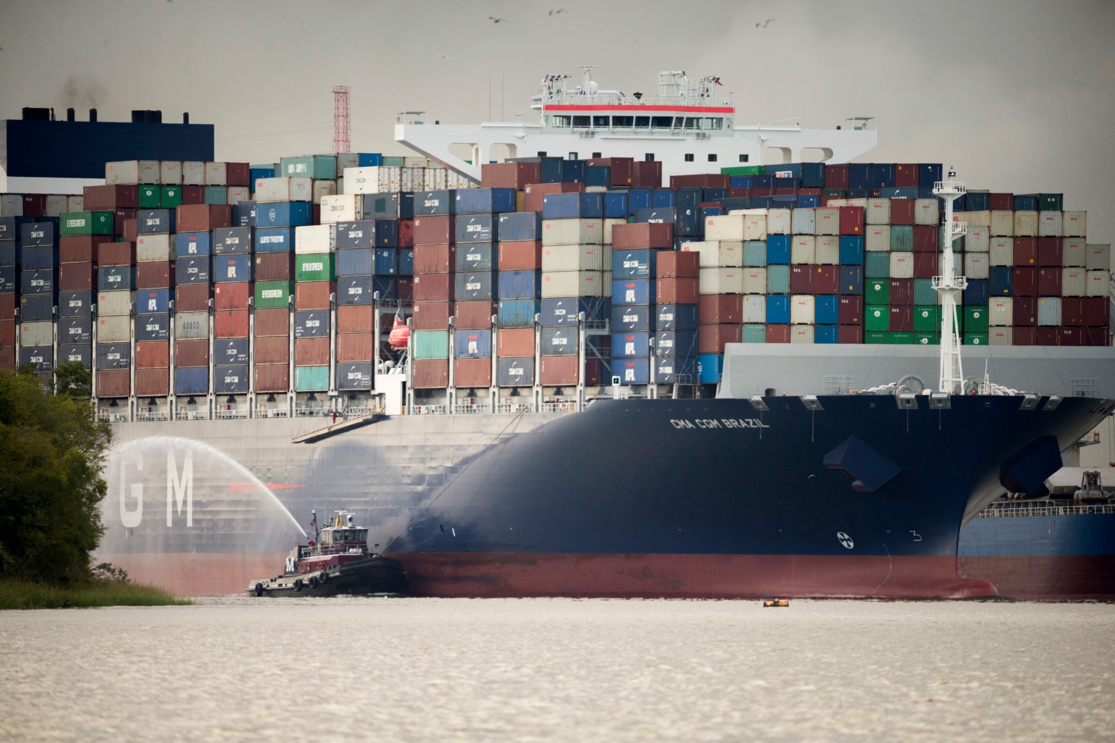 SAVANNAH, GA - SEPTEMBER 18, 2020: The Moran tugboat Laura K. Moran escorts the CMA CGM Brazil as it sails up the Savannah River to the Georgia Ports Authority's Garden City Terminal, Friday, Sept., 18, 2020, in Savannah, Ga. (AJC Photo/Stephen B. Morton)