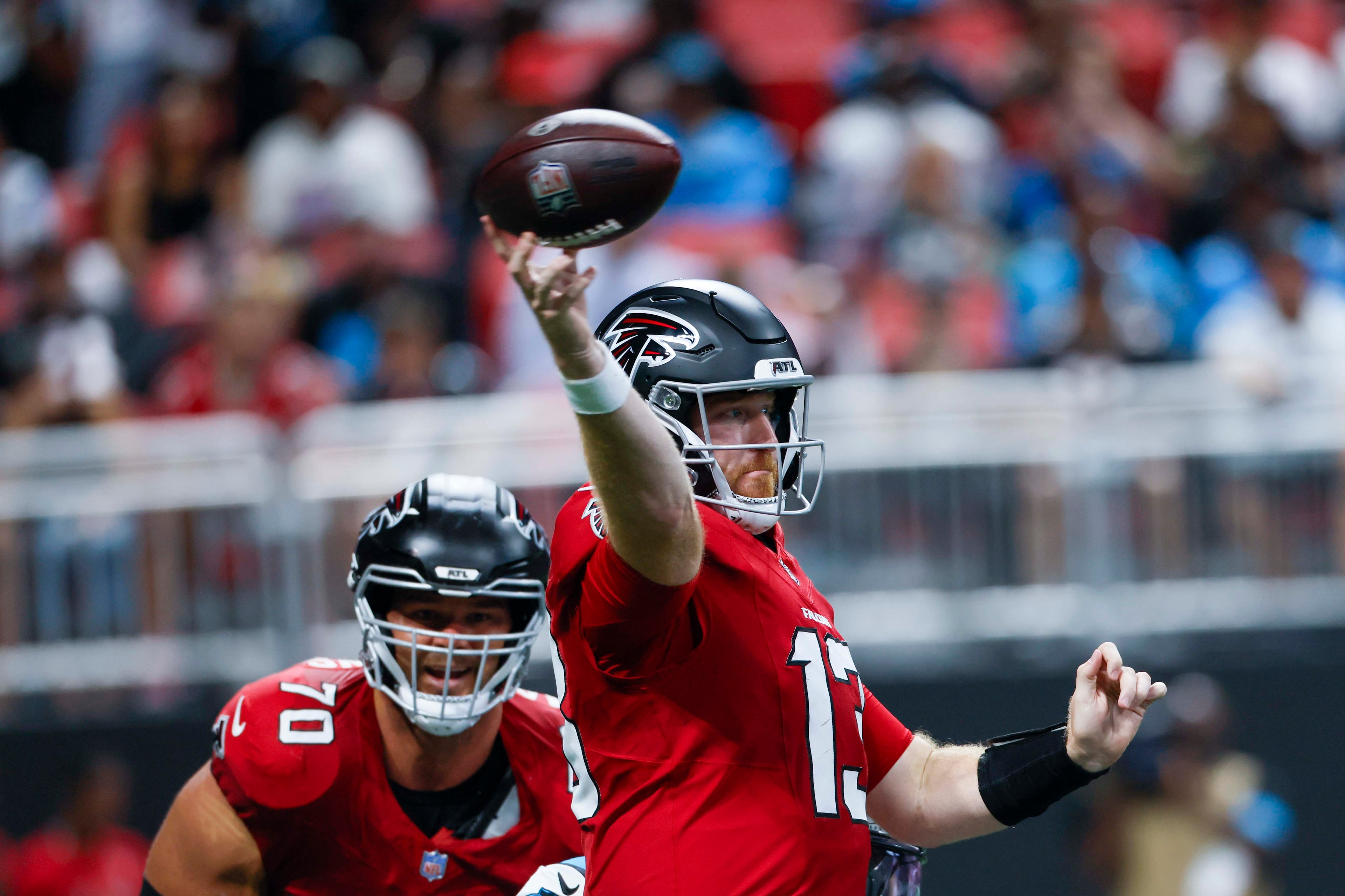 Atlanta Falcons quarterback Cooper Rush (13) attempts a pass in the first half of an NFL game against the Carolina Panthers at Mercedes-Benz Stadium in Atlanta on Sunday, September 20, 2026. (Miguel Martinez/AJC)