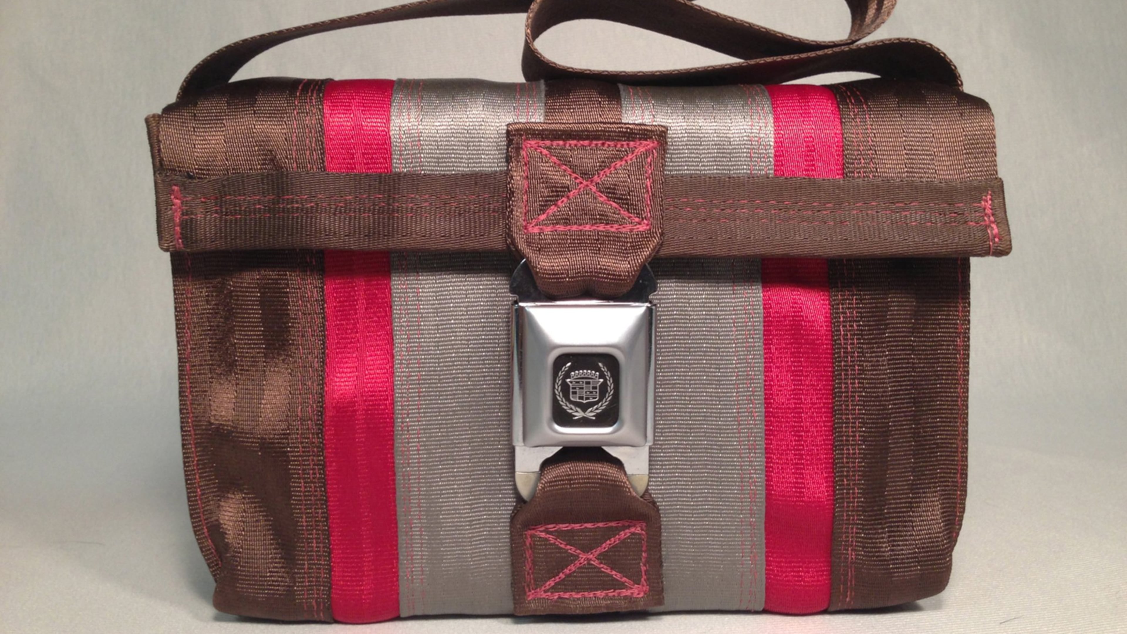 Stylish bags are made from seat belts. Source: Clay Bush/Salvage.