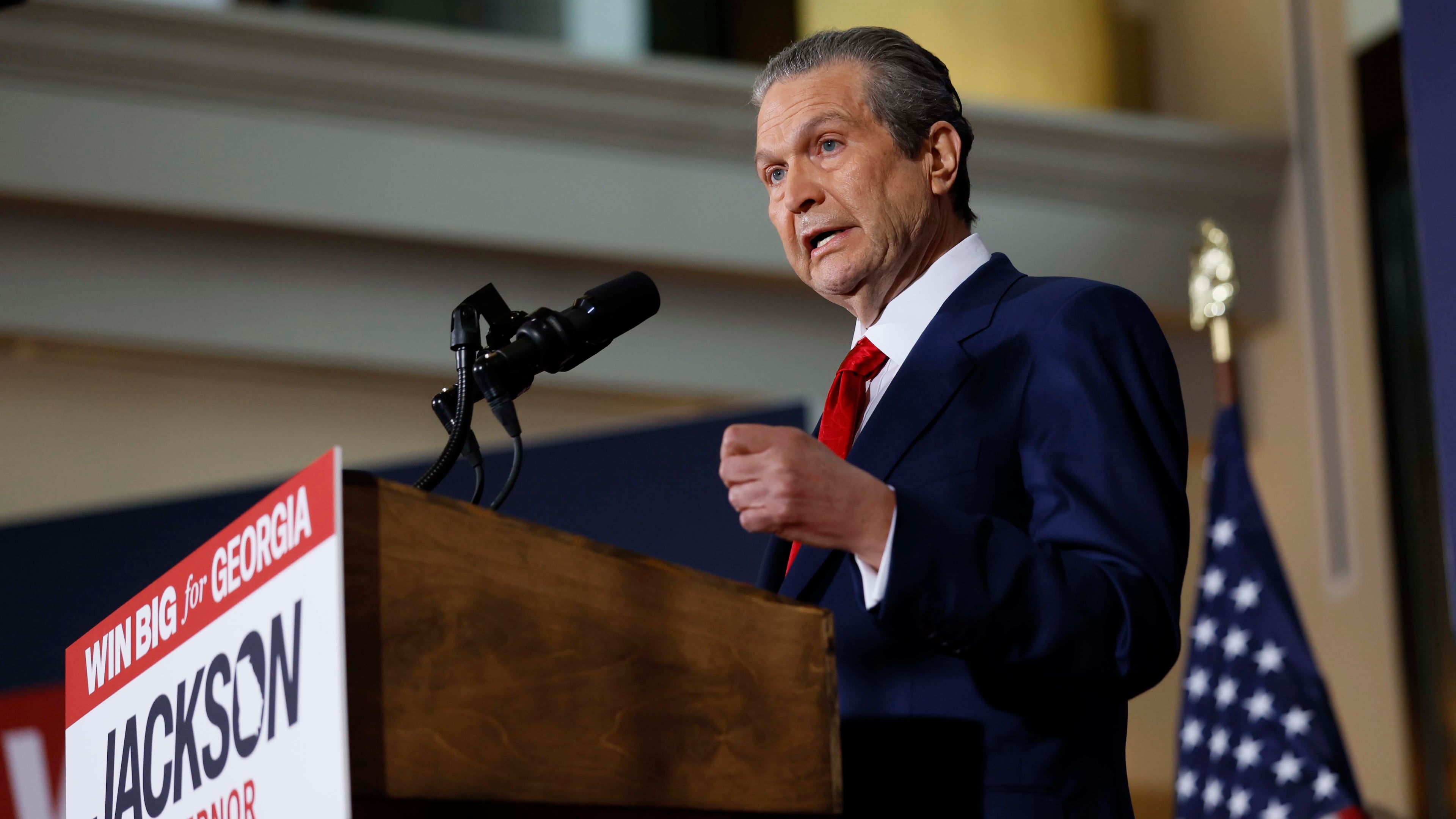 Health care business owner Rick Jackson’s latest TV spot features a narrator accusing Lt. Gov. Burt Jones of “lying” about Jackson — before cutting to a short clip of Jones from December praising him as a “good friend.” (Miguel Martinez/AJC)