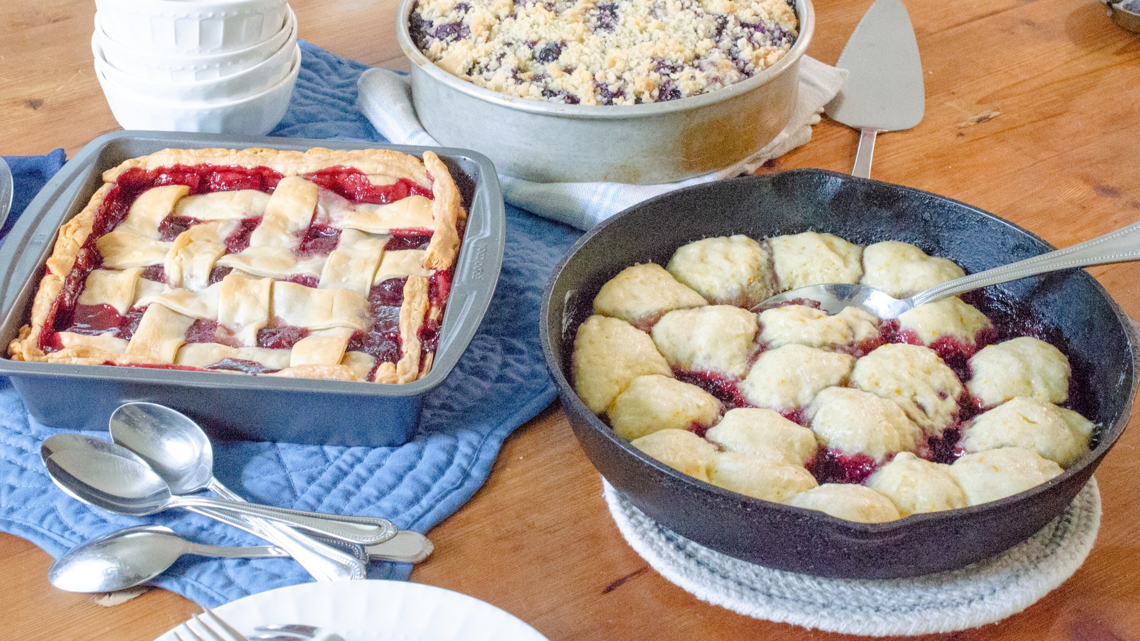 Cherry Sonker (clockwise from left), Blueberry Buckle and Blackberry Slump are three unusually named desserts that celebrate summer fruit. (Virginia Willis for the AJC)
