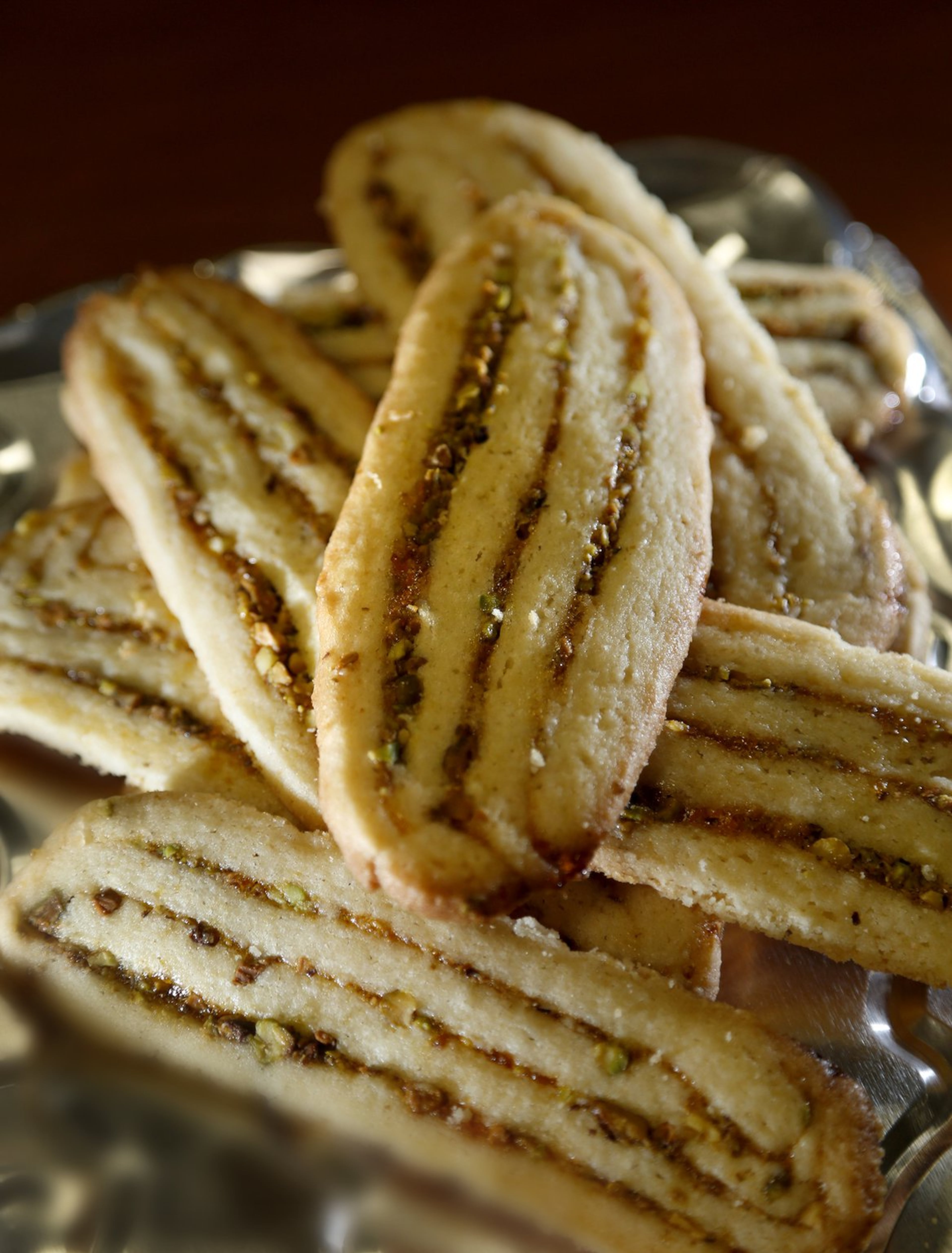 FIRST PLACE: Peachy Pistachio Icebox Cookies by Roxanne Williams of Springboro. LISA POWELL/STAFF