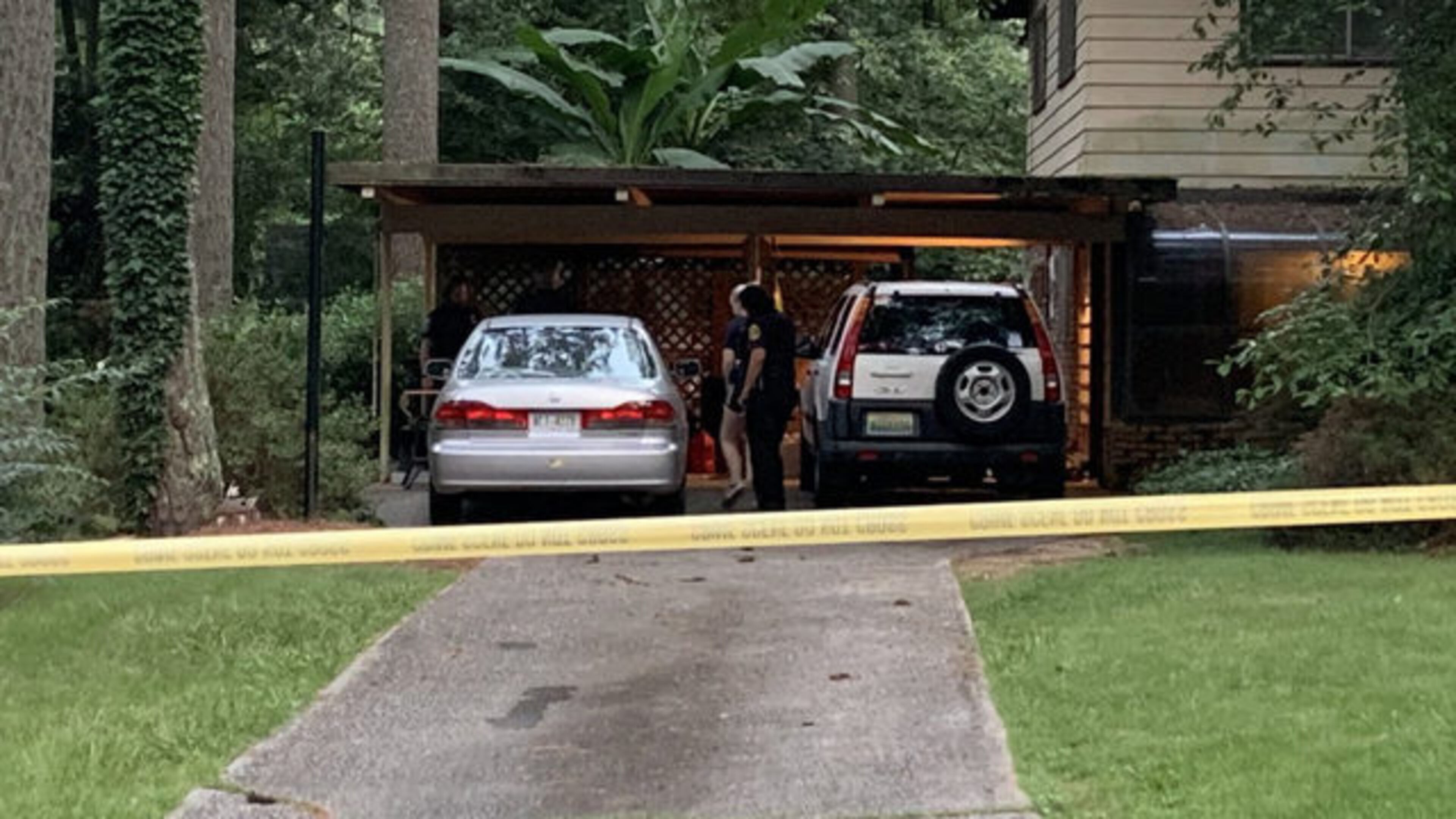 <p>House where a man was shot and killed in DeKalb County</p> <p>DeKalb Police officers wait inside carport on Northlake Trail or homicide detectives have been called to investigate shooting </p>