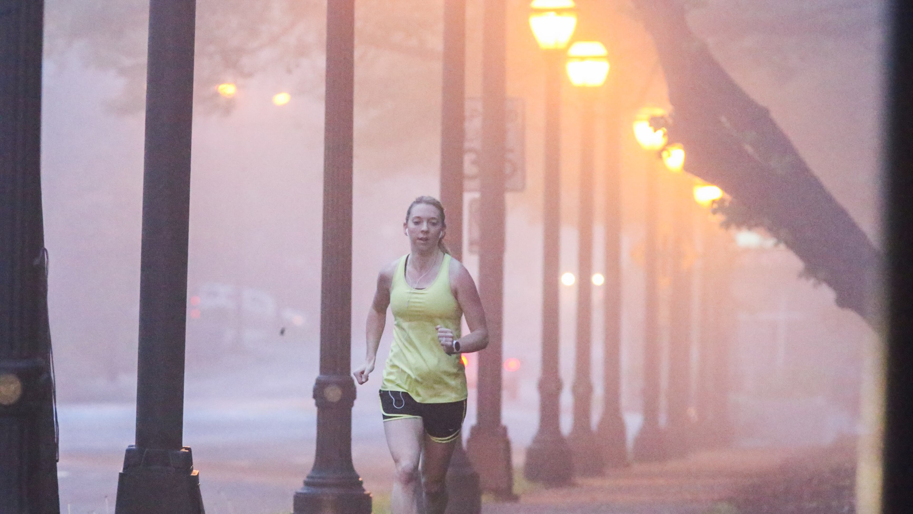 Patchy fog in Atlanta early Tuesday did not stop Molly Slesnick from completing her 8-mile run, which took her through Piedmont Avenue. JOHN SPINK / JSPINK@AJC.COM