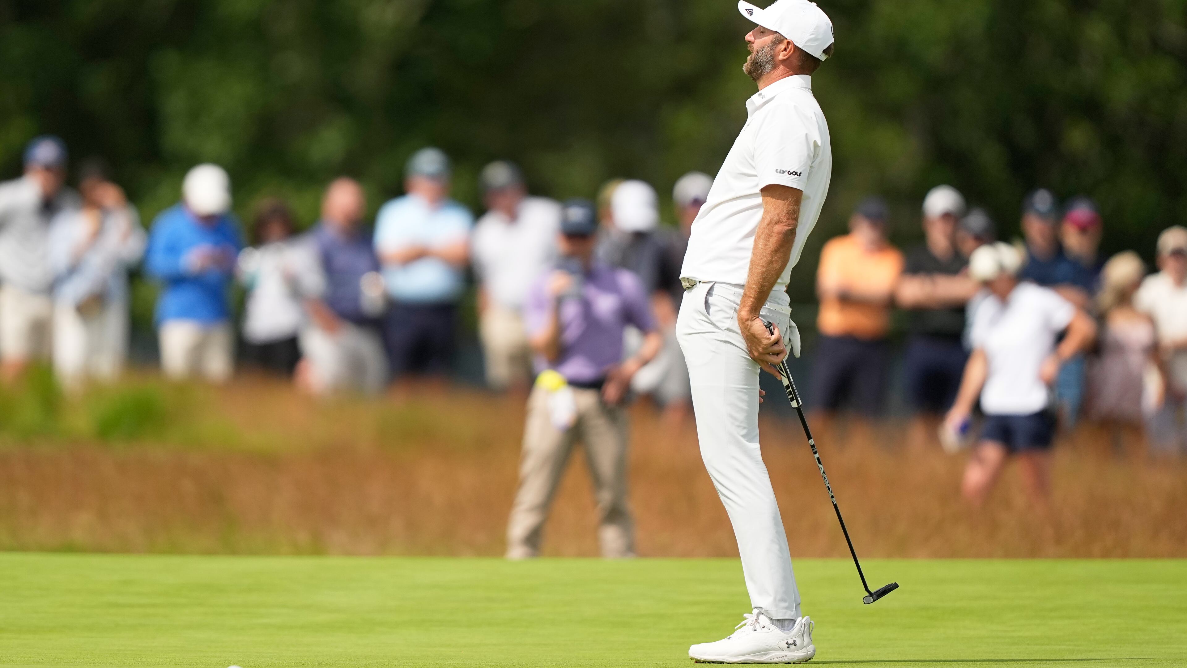 Dustin Johnson reacts after missing a putt during the second round of the U.S. Open golf tournament at Shinnecock Hills Golf Club in Southampton, N.Y., Friday, June 19, 2026.(AP Photo/Gerald Herbert)