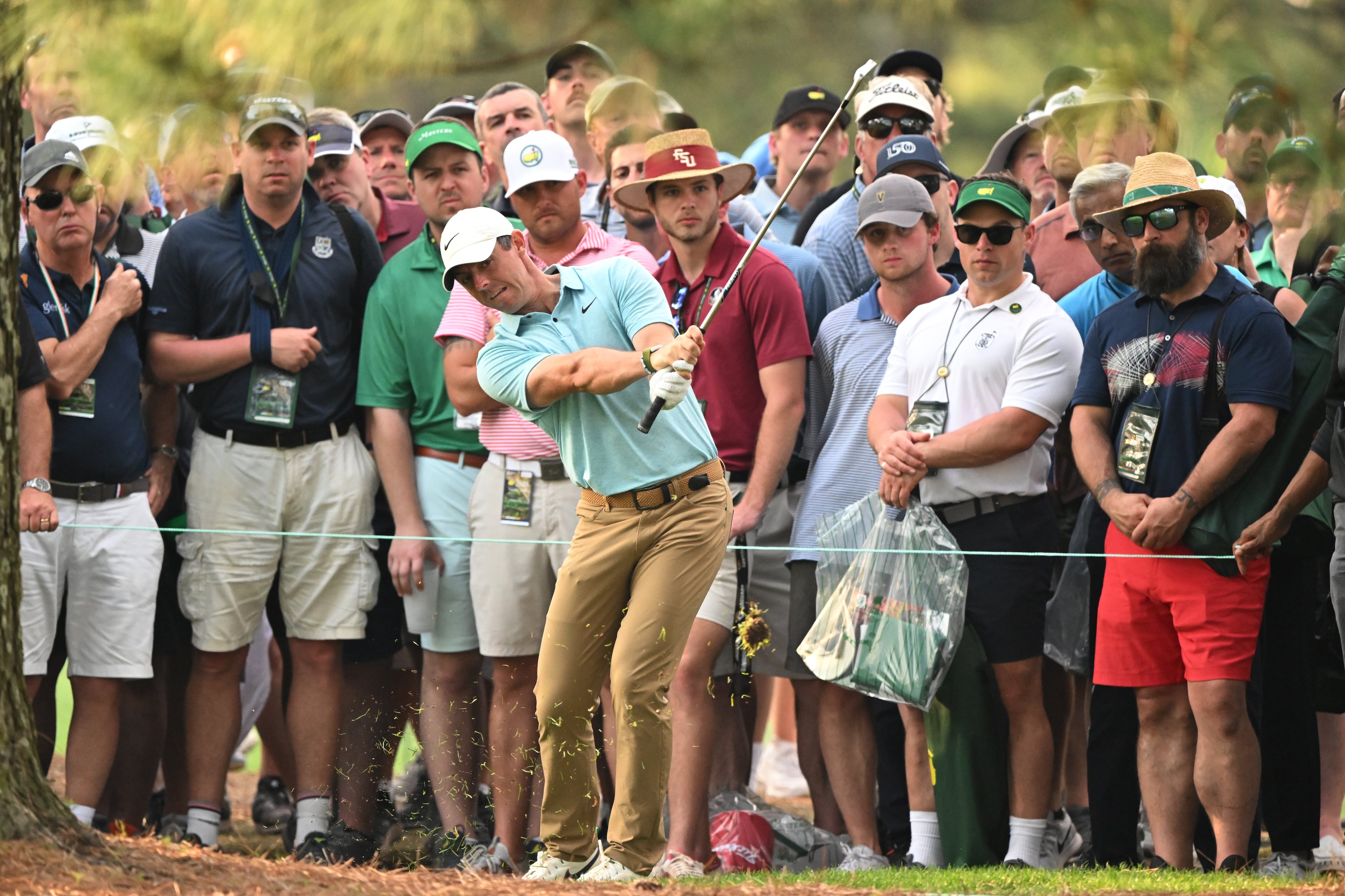 Rory McIlroy hits from the rough not he 17th fairway during first round of the 2023 Masters Tournament at Augusta National Golf Club, Thursday, April 6, 2023, in Augusta, Ga. (Hyosub Shin / Hyosub.Shin@ajc.com)