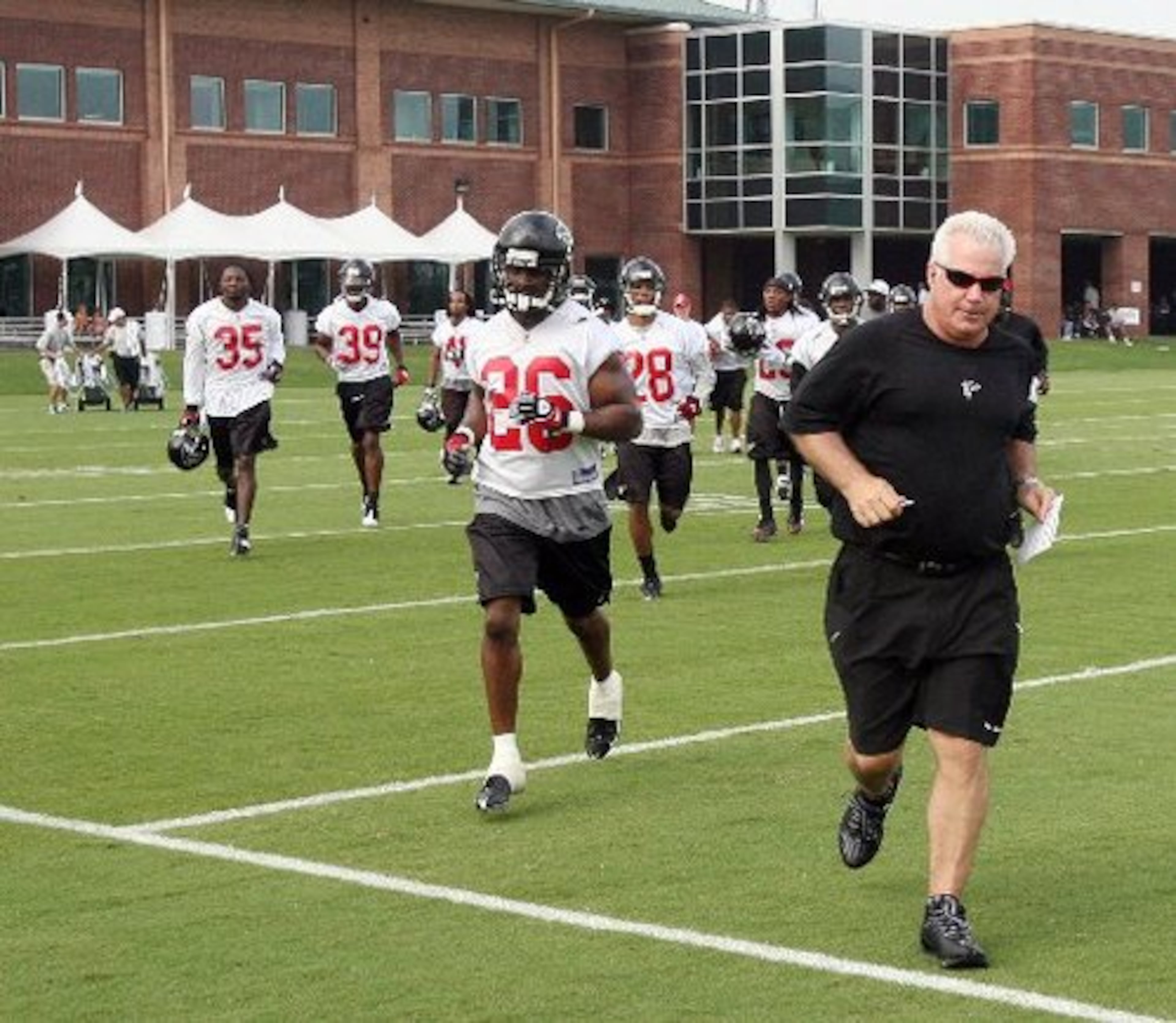 Smith leads the team out for first practice of traning camp on July 26, 2008, in Flowery Branch.