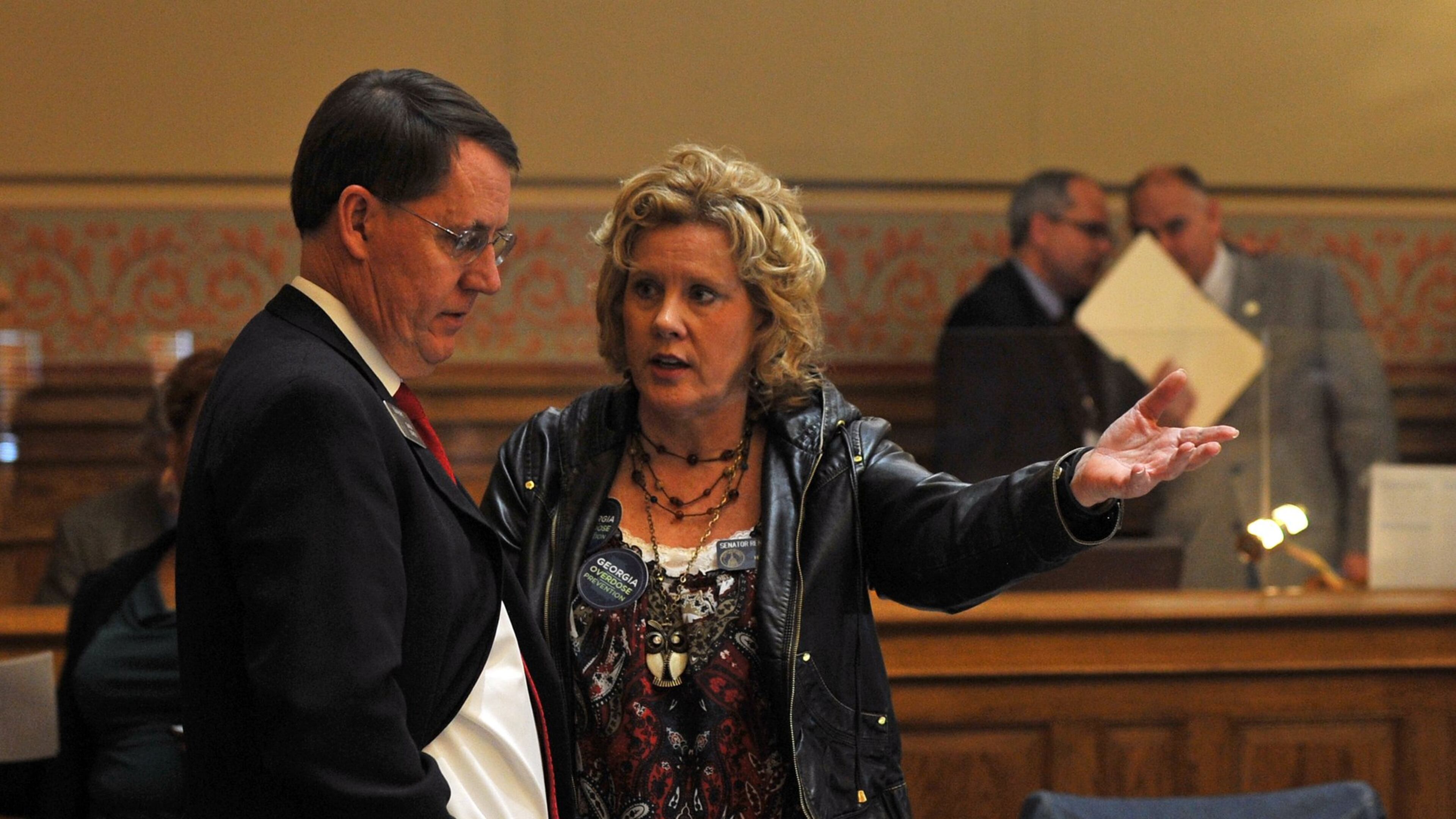 Sen. Renee Unterman, R-Buford, talks Thursday with Sen. Dean Burke, R-Bainbridge. BRANT SANDERLIN /BSANDERLIN@AJC.COM