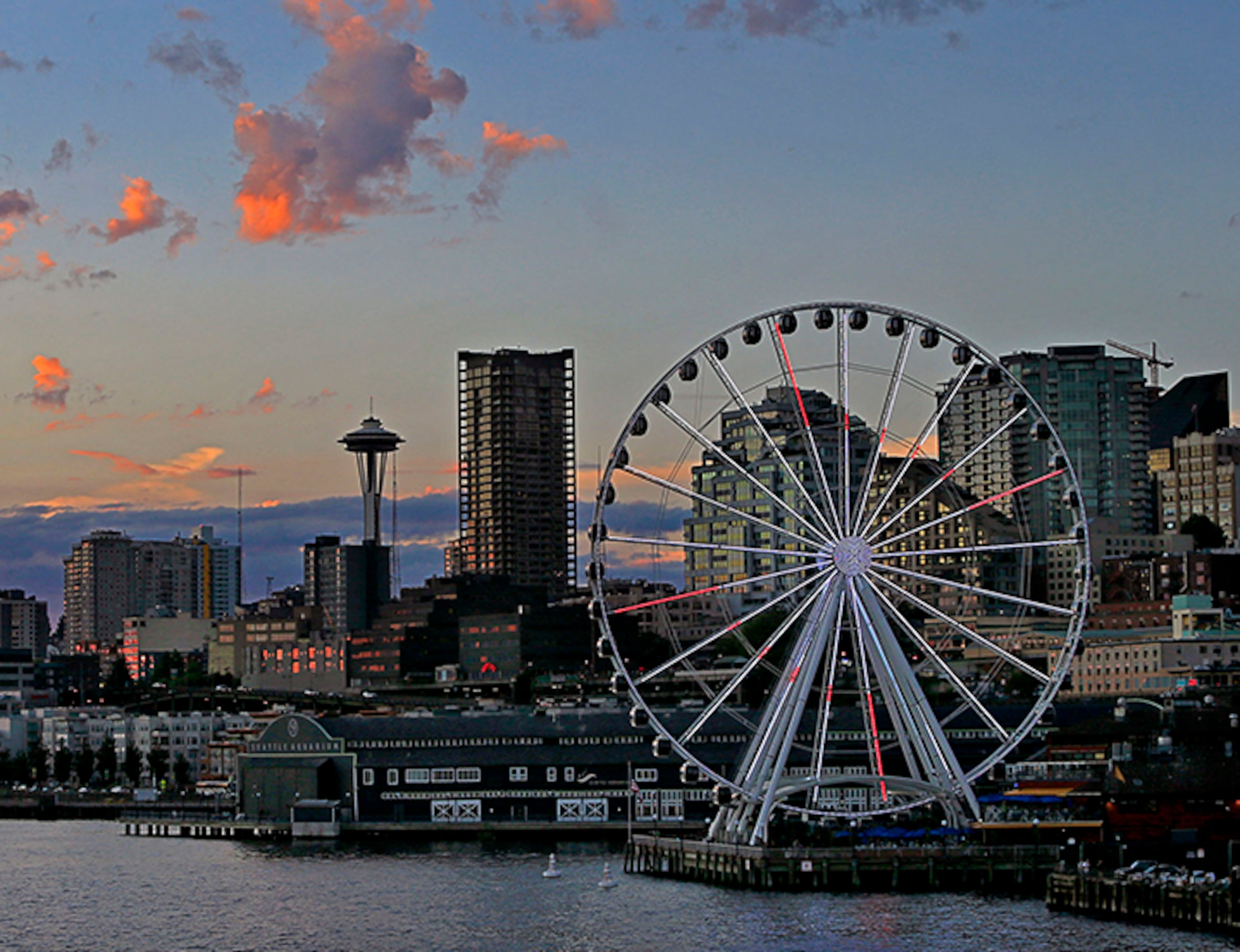 One woman was killed and at least seven people were injured in a shooting Wednesday night near the Pike Place Market in downtown Seattle.