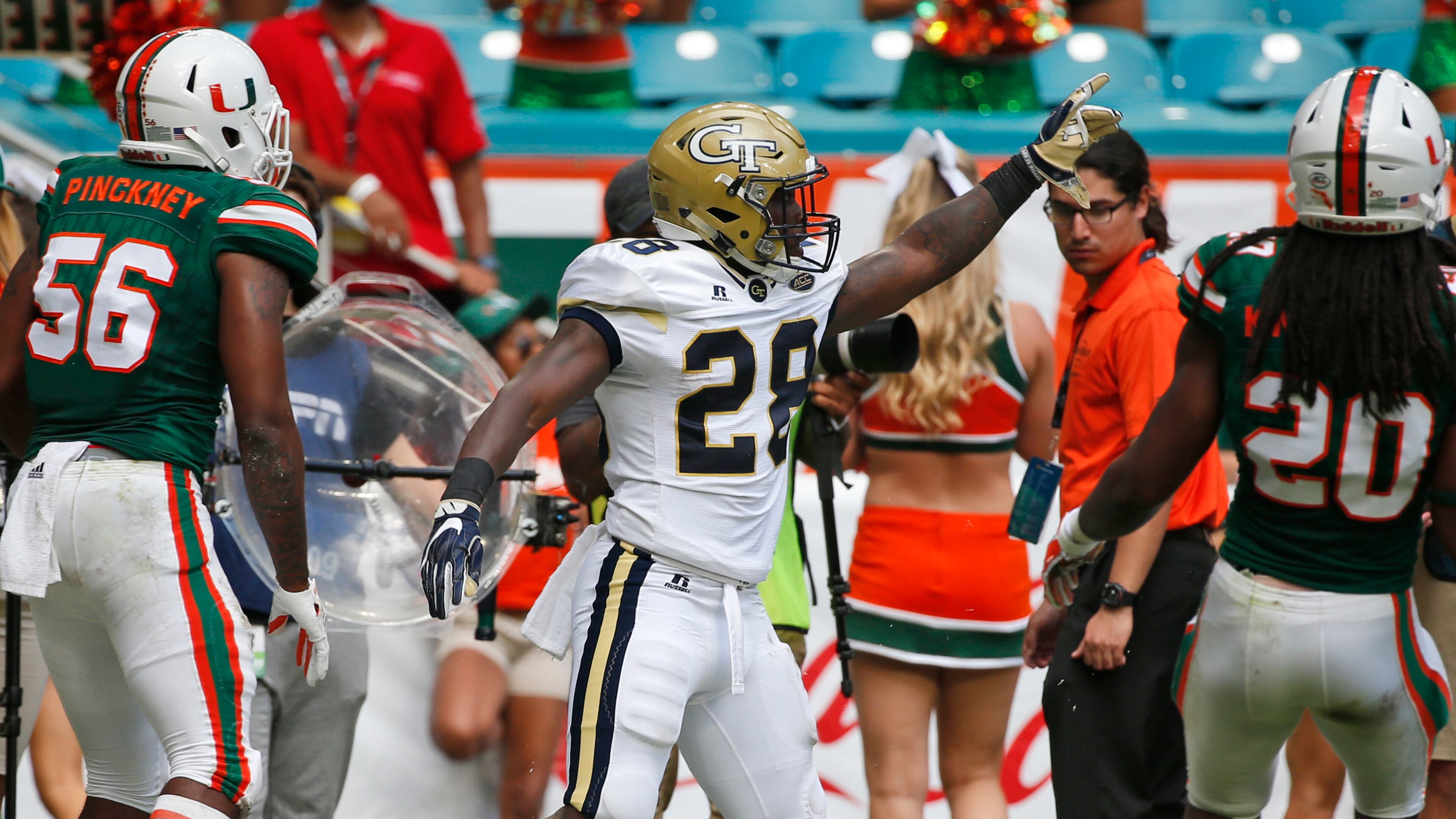 Georgia Tech running back J.J. Green (28) celebrates after scoring during the first quarter of Saturday's game in Miami Gardens, Fla. (AP Photo/Wilfredo Lee)