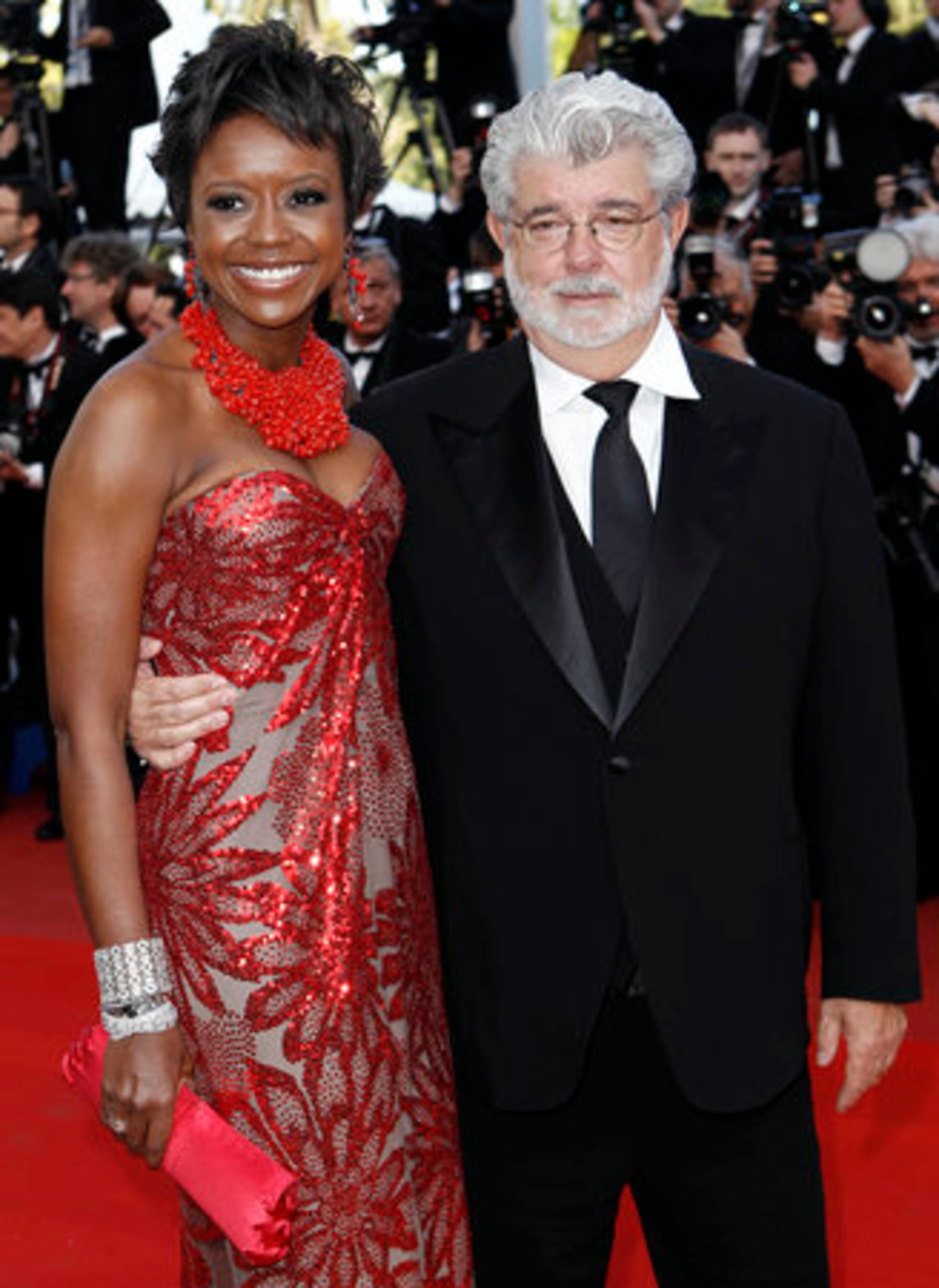 Film maker George Lucas, right, and Mellody Hobson arrive for the screening of "Wall Street Money Never Sleeps", at the 63rd international film festival, in Cannes, southern France, Friday, May 14, 2010.