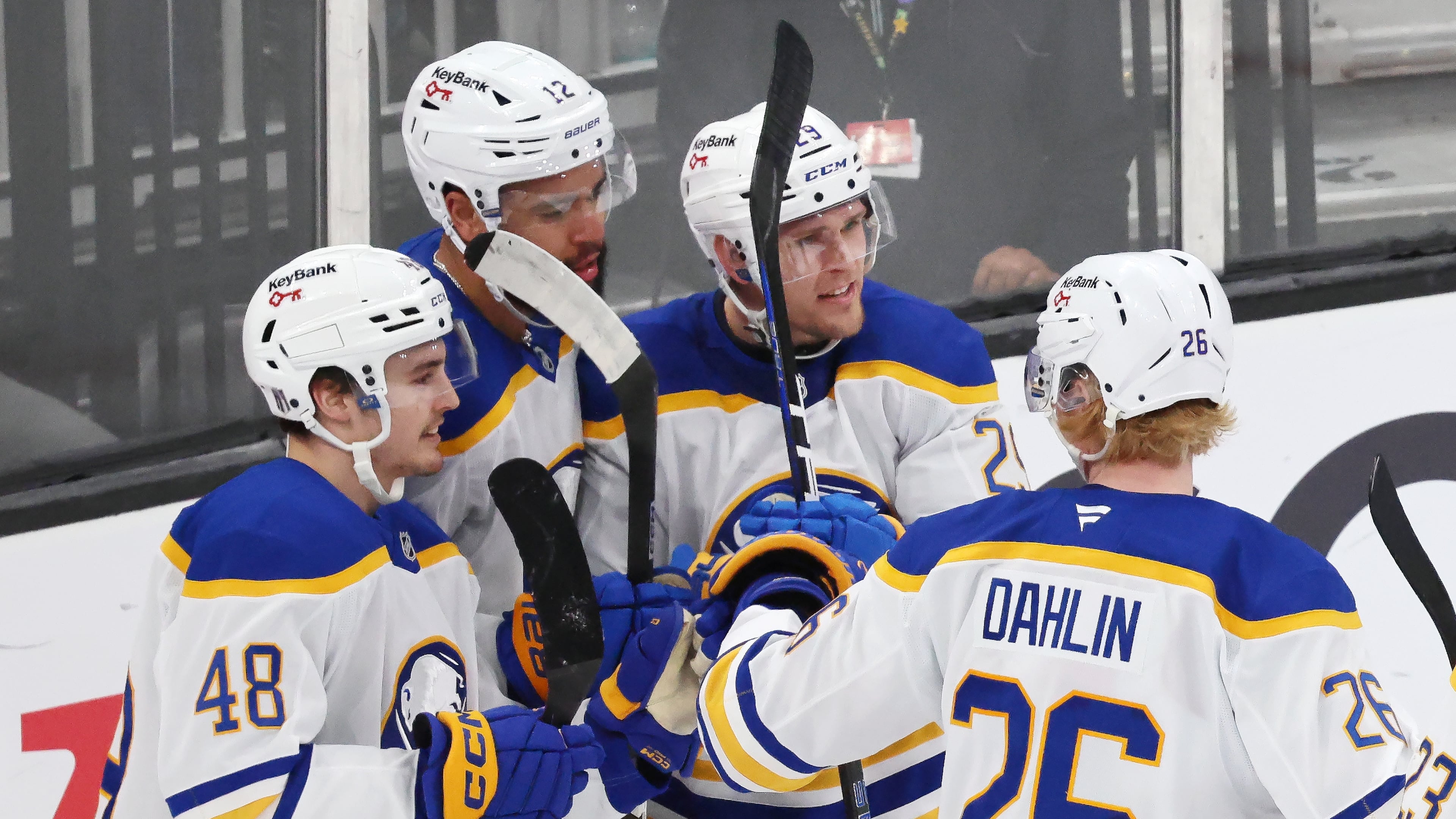Buffalo Sabres' Beck Malenstyn (29) celebrates after his goal with teammates Tyson Kozak (48), Jordan Greenway (12) and Rasmus Dahlin (26) during the third period in Game 4 of a first-round NHL hockey Stanley Cup playoff series against the Boston Bruins, Sunday, April 26, 2026 against the Boston Bruins, in Boston. (AP Photo/Michael Dwyer)