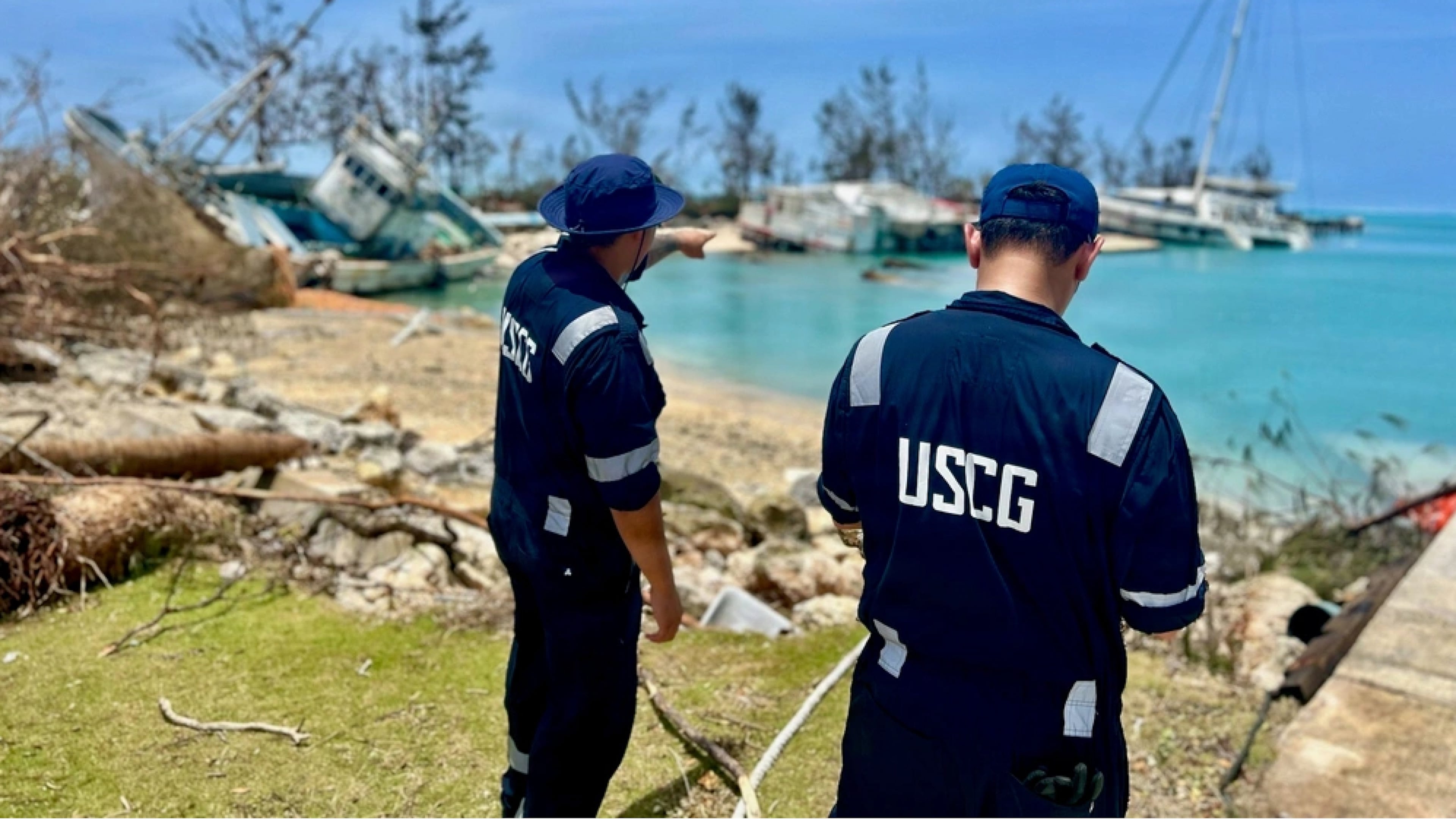 This photo provided by the U.S. Coast Guard , U.S. Coast Guard responders assess Smiling Cove in Saipan on April 18, 2026. (Lt. Whip Blacklaw/U.S. Coast Guard via AP)