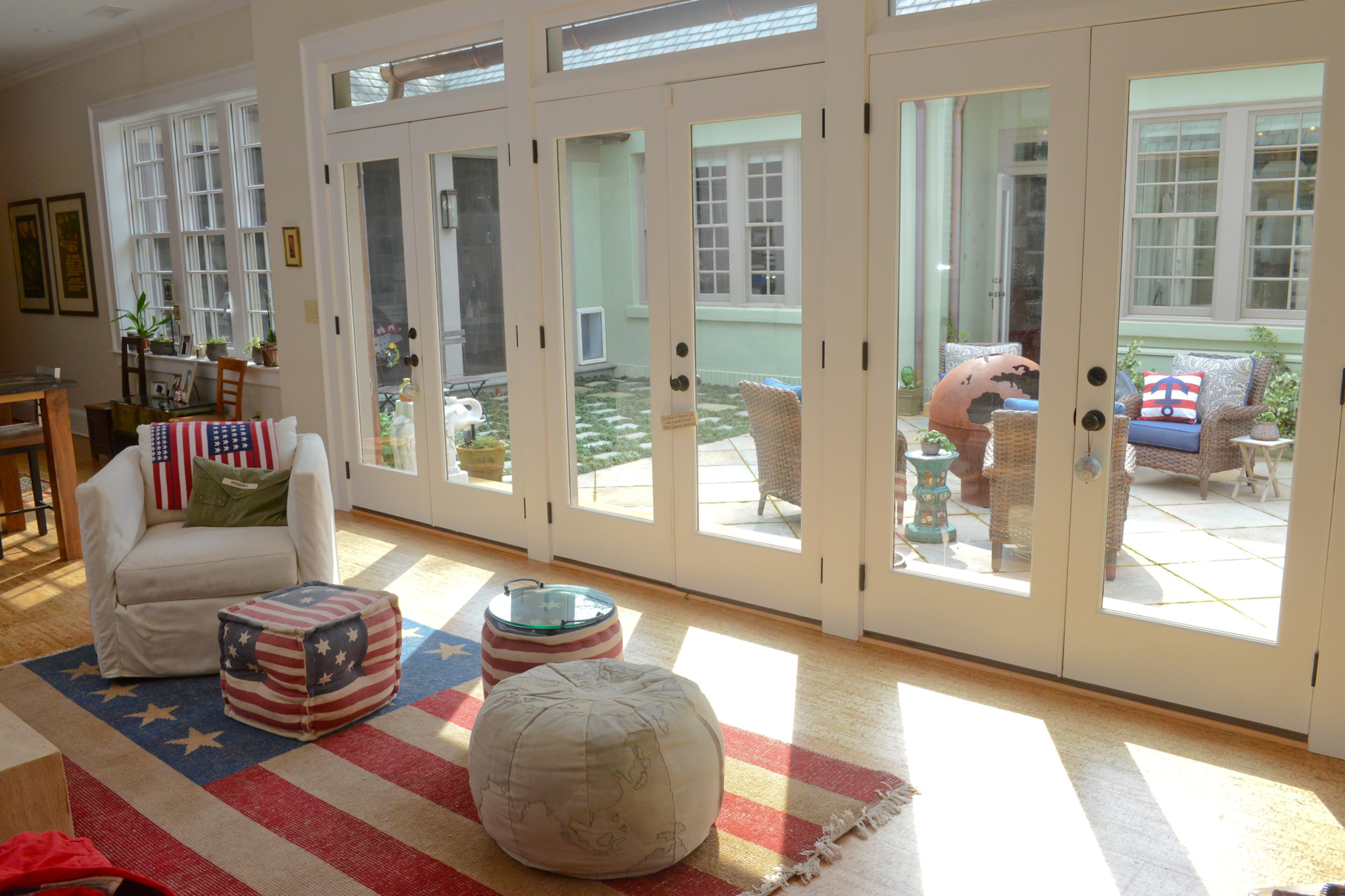 When the homeowners expanded their 1918 cottage to add a family room off the kitchen, they included a series of French doors that open onto the enclosed courtyard patio. Natural light fills the family room, and the doors promote easy indoor-outdoor flow.