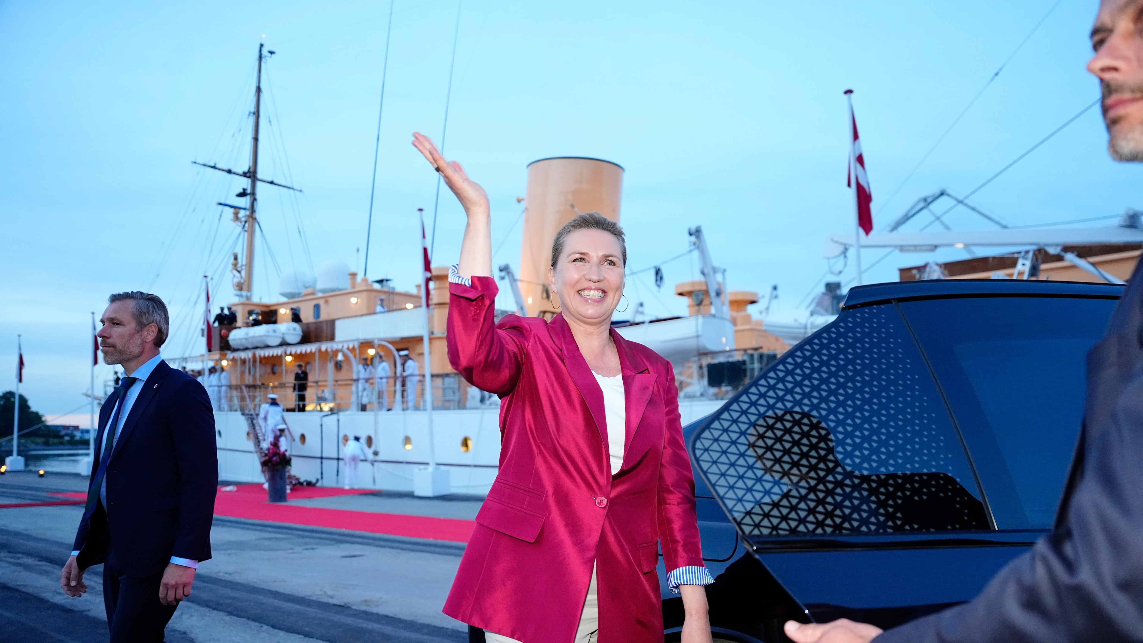 Acting Prime Minister Mette Frederiksen, center, waves on the royal ship Dannebrog on Monday, June 1, 2026, as the royal ship Dannebrog is docked at Odense Harbor. (Sebastian Elias Uth/Ritzau Scanpix via AP)