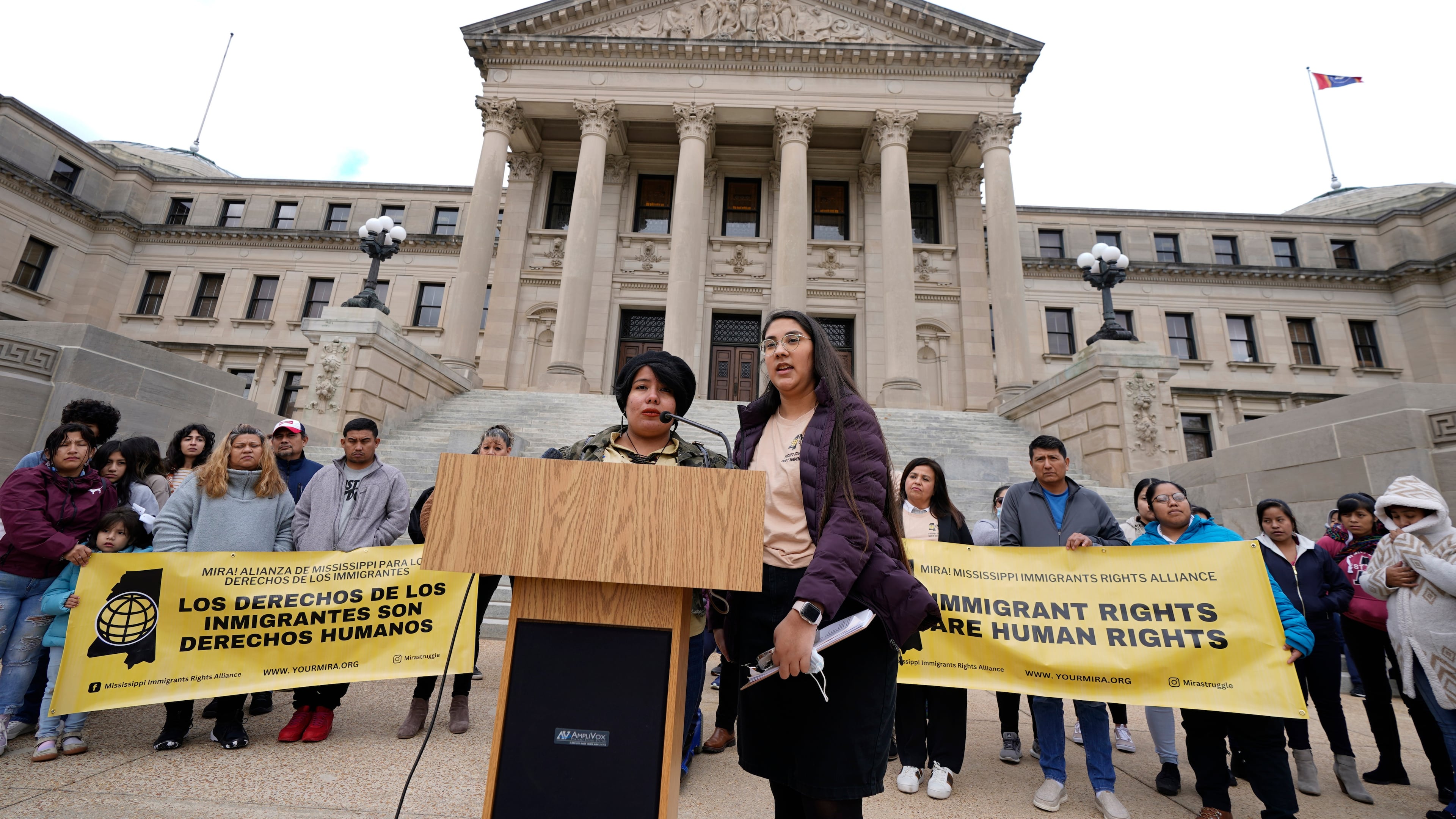 FILE - Yaritza Herrera, left, a young mother in central Mississippi, speaks about her concerns regarding legislative proposals affecting immigrants and migrants, as Loida Ventura Paz of the Mississippi Immigrants' Rights Alliance translates from Spanish to English, during a news briefing before entering the Mississippi Capitol and lobbying lawmakers about those proposals, in Jackson, Wednesday, Jan. 25, 2023. (AP Photo/Rogelio V. Solis, File)
