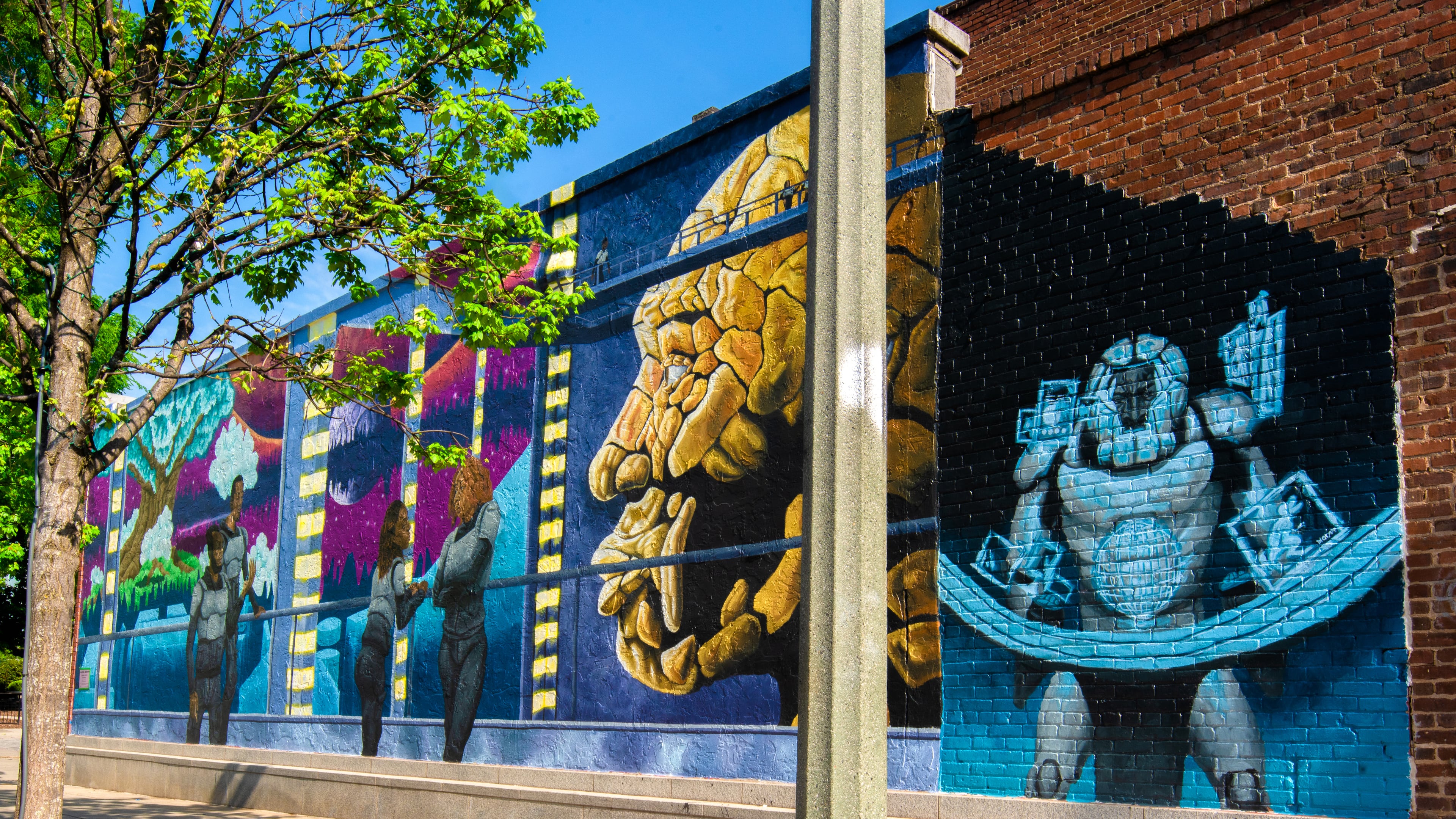 Tim Short's mural "Earthseed" at Squash Blossom Boutique. (Brock Scott/On The Grid).