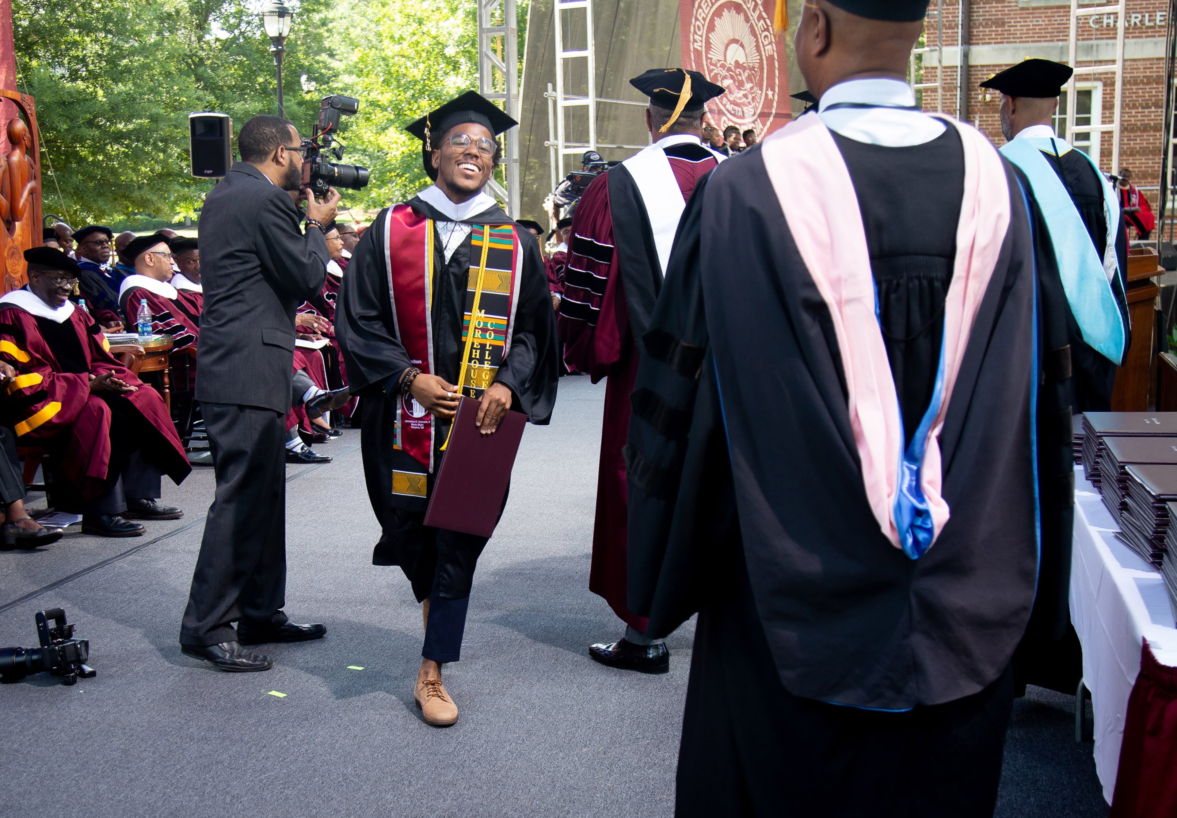 Jonathan Alvarado smiles after receiving his diploma during the Morehouse College graduation ceremony in Atlanta on Sunday, May 19, 2019. STEVE SCHAEFER / SPECIAL TO THE AJC