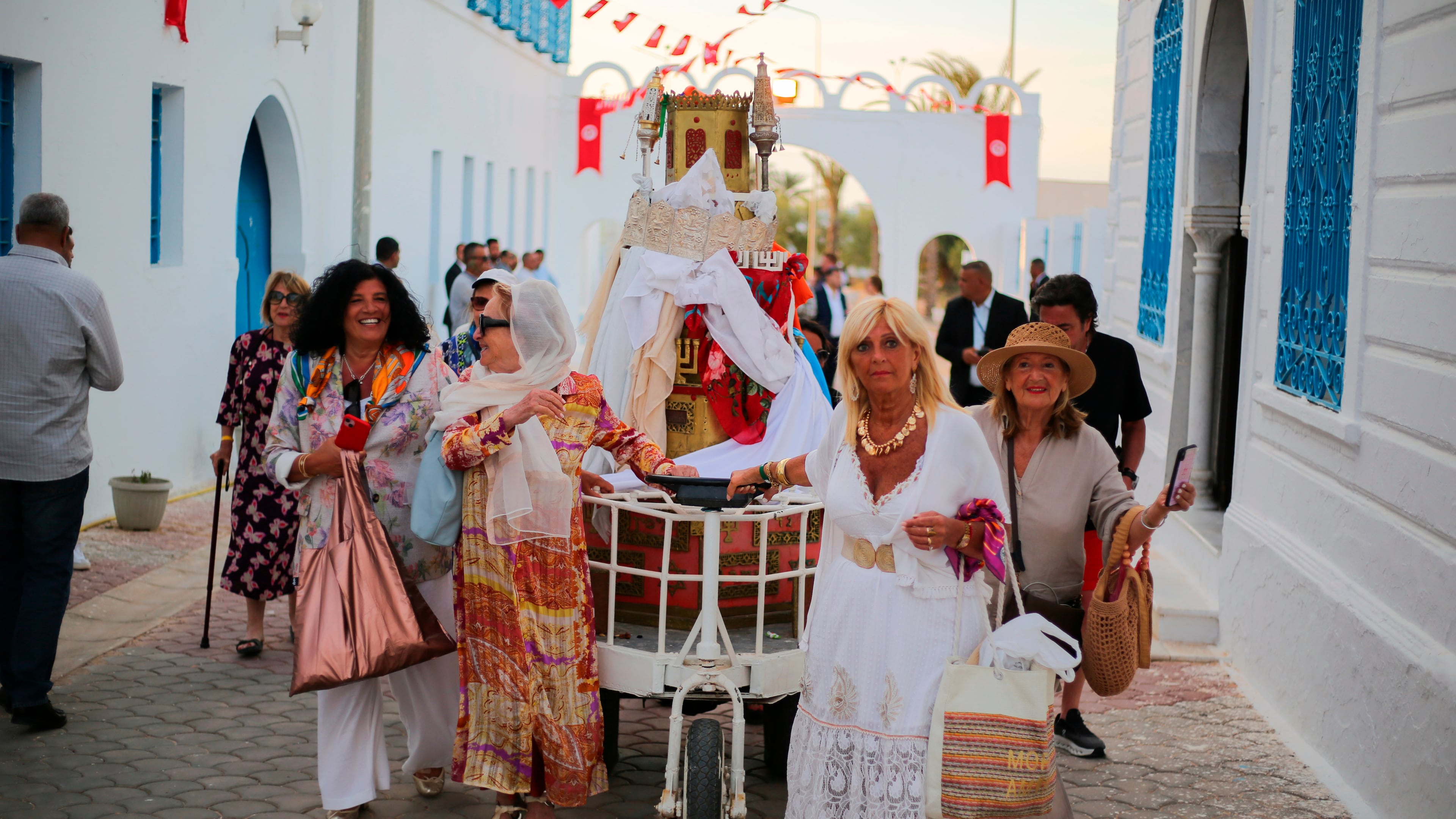 Jewish pilgrims take part in a procession as they attend an annual pilgrimage at the Ghriba synagogue in the resort of Djerba, Tunisia, on Monday, May 4, 2026. (AP Photo/Bassem Aouini)
