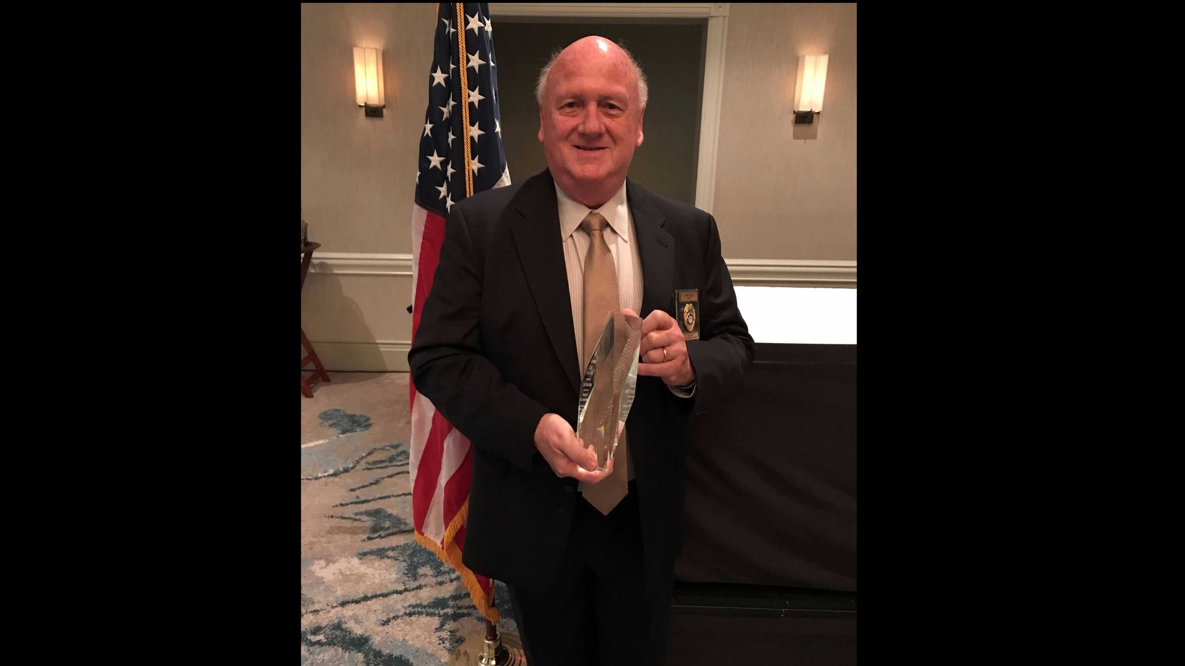 Marietta's police chief Dan Flynn poses with his new Georgia Association of Chiefs of Police "Chief of the Year" award.
