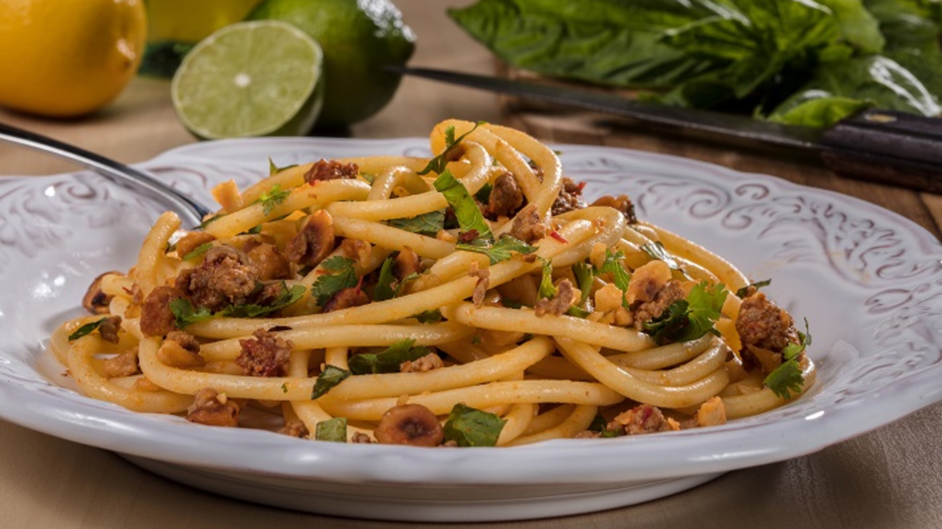 Bucatini, a long, spaghetti-like noodle with a hole running through the length of it, is tossed with hazelnuts, red pepper paste, lamb and fresh herbs. (Zbigniew Bzdak/Chicago Tribune/TNS)