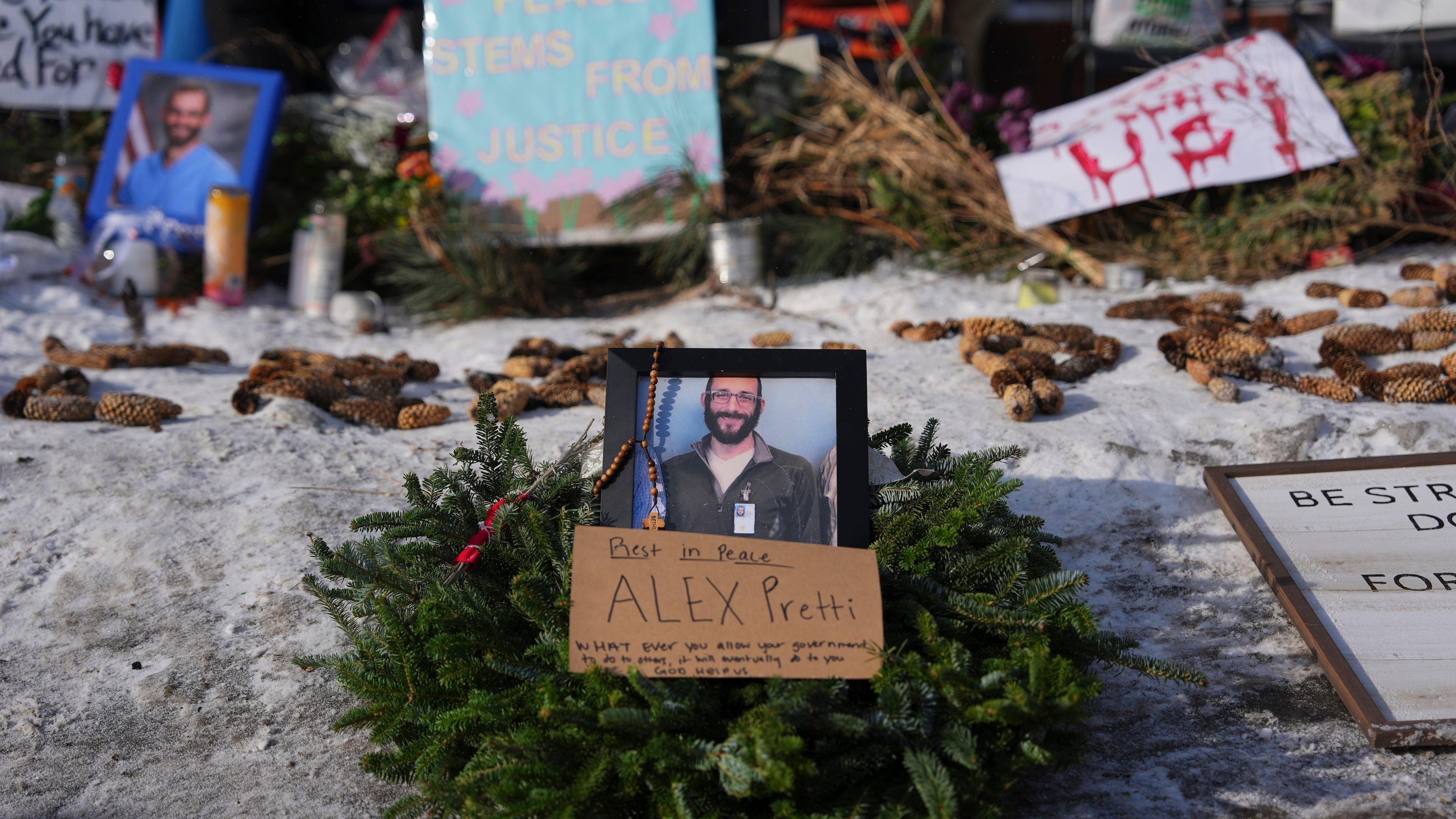 A makeshift memorial is placed where Alex Pretti was fatally shot by a U.S. Border Patrol officer yesterday, in Minneapolis, Sunday, Jan. 25, 2026. (Adam Gray/AP)