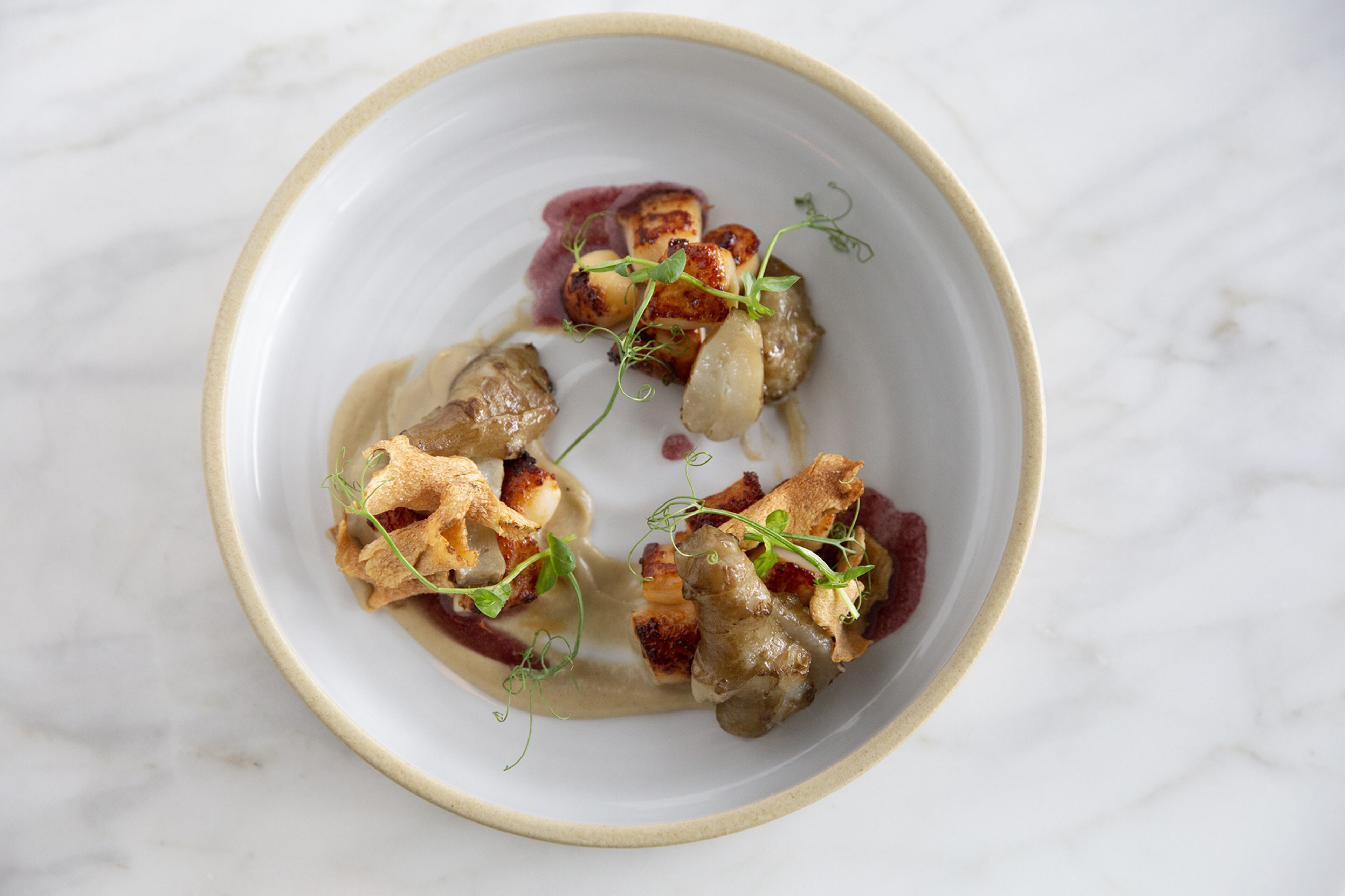 Nantucket Bay Scallops With Leeks and Black Truffle Vinaigrette is a simple dish that chef Anne Quatrano says expresses the importance of great ingredients.