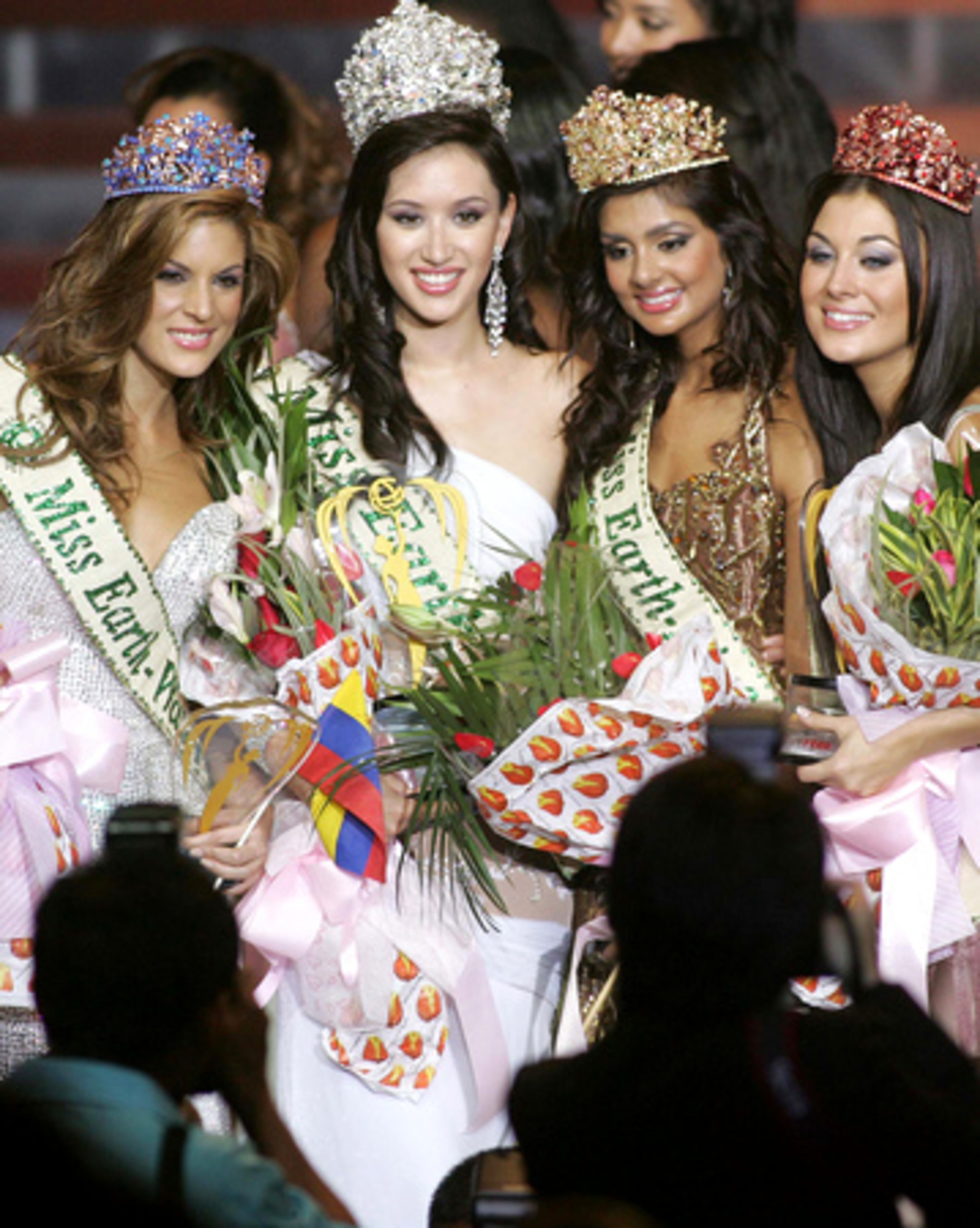 Miss Earth 2007, Miss Canada Jessica Nicole Trisko, second from right, is flanked by, from left, Miss Earth-Water, Silvana Santaella Arellano from Venezuela, Miss Earth-Air, Pooja Chitgopekar from India, and Miss Earth-Fire, Angela Gomez from Spain during the coronation night in suburban Quezon City, north of Manila late Sunday Nov. 11, 2007.