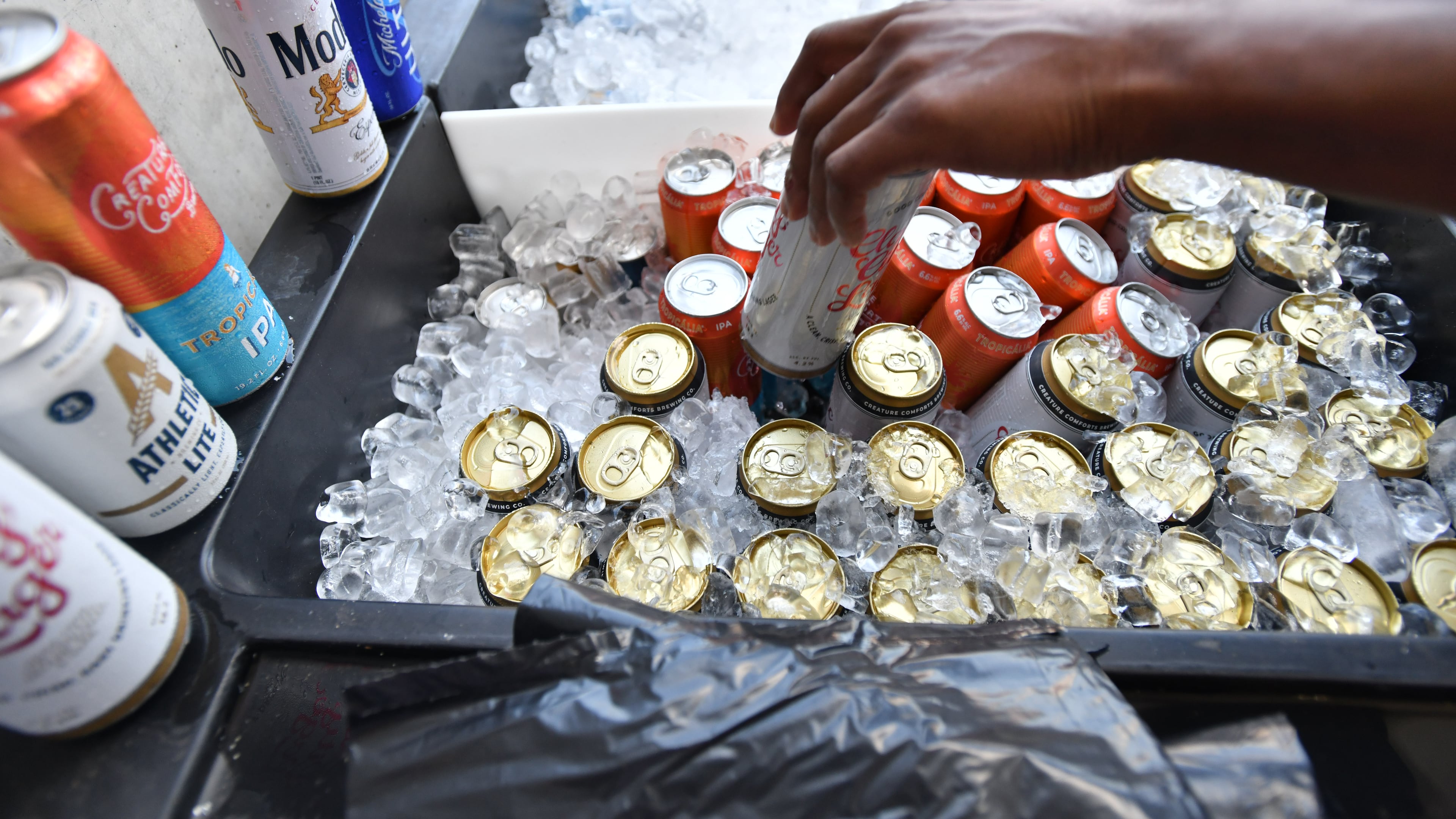 Georgia football fans buy beers before the Bulldogs' home opener against Tennessee Tech at Sanford Stadium in September 2024. (Hyosub Shin/AJC)