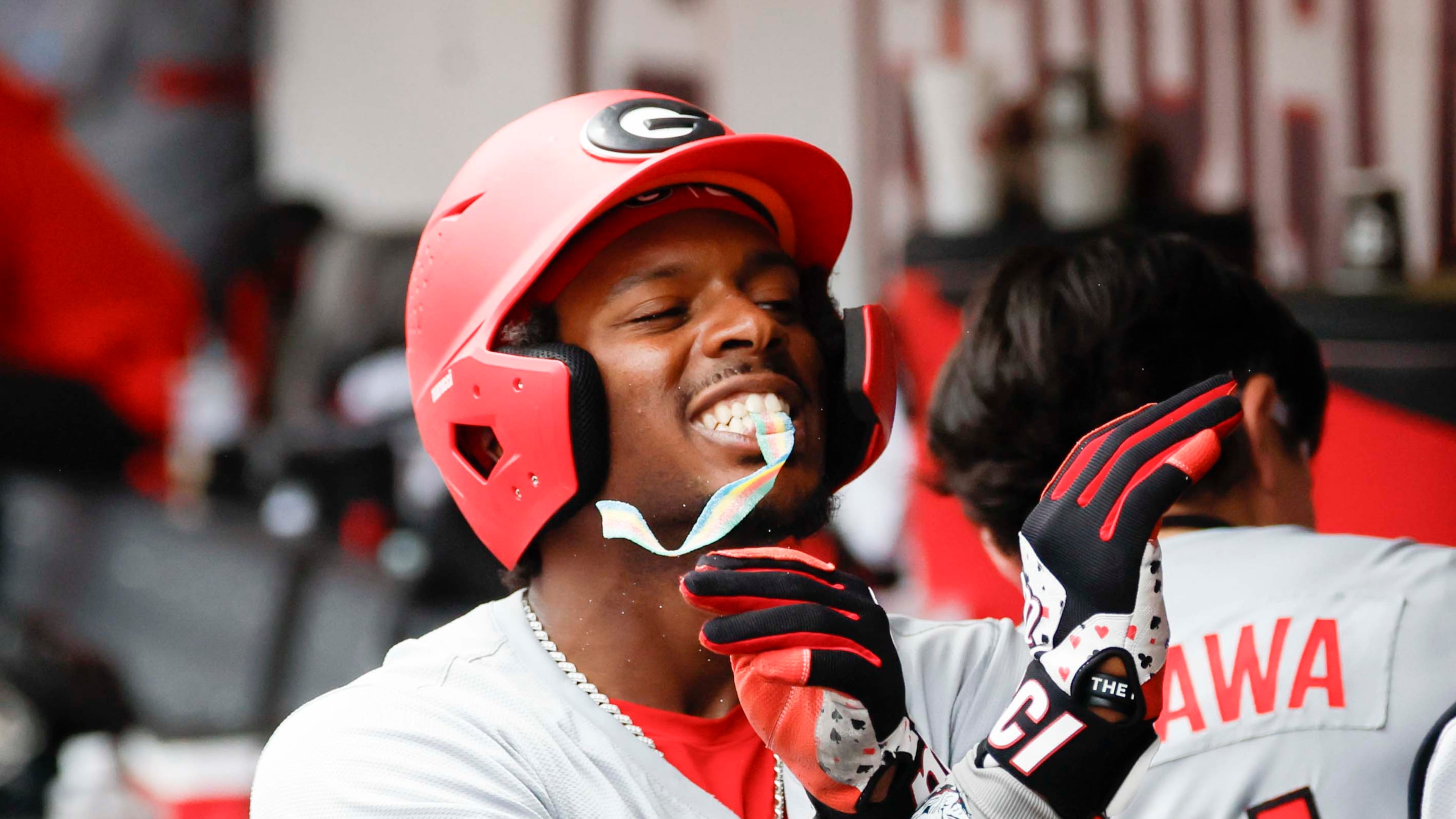 Georgia Bulldogs infielder Tre Phelps receives sour candy after scoring a run at Foley Field on Sunday, June 7, 2026, in Athens. This year, the Bulldogs won the SEC Tournament title for the first time in program history. (Miguel Martinez/AJC)