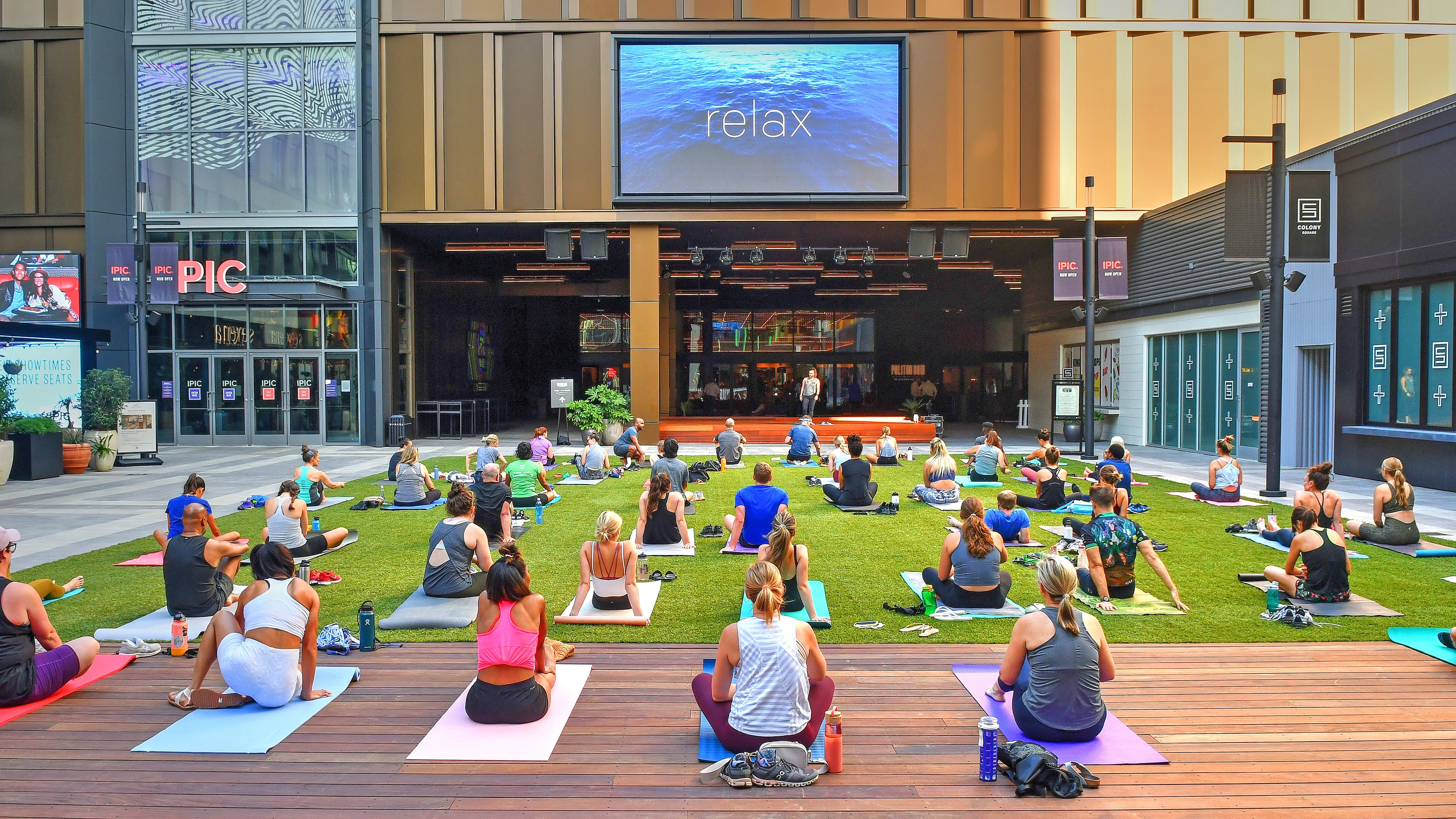 A grass courtyard that offers yoga classes is just outside the entrance to the new Politan Row food hall at Colony Square, 1197 Peachtree Road, Atlanta Ga. Photos taken Wednesday June 23, 2021. (Chris Hunt for The Atlanta Journal-Constitution)