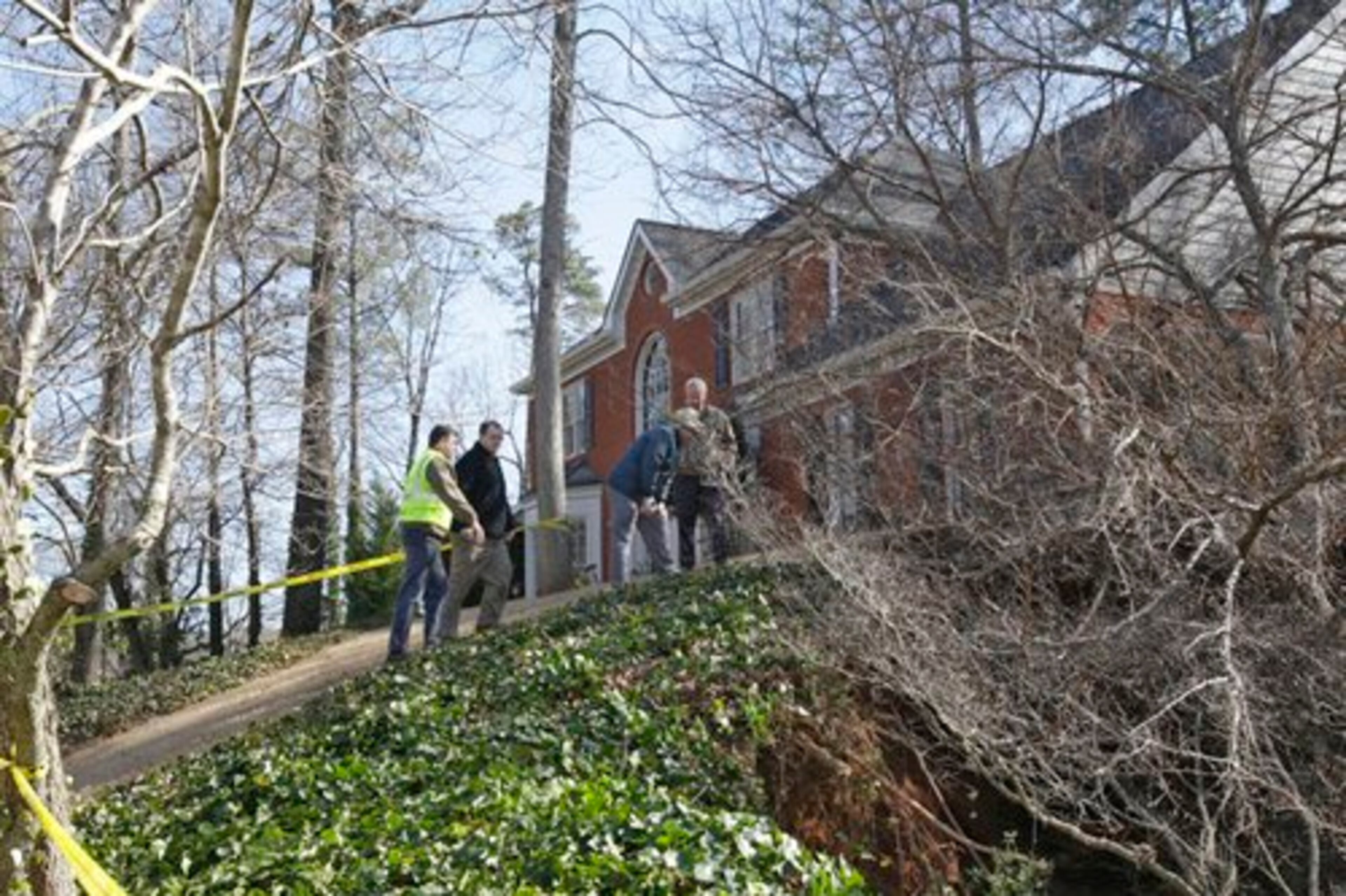 Homeowner Lisa Thompson told the city's director of public works, Dan Conn, that she saw the tree fall following Sunday's rain and the ground open up. Conn said Thompson's house appears to have been spared, but a neighbor's residence may have shifted as a result of the hole.