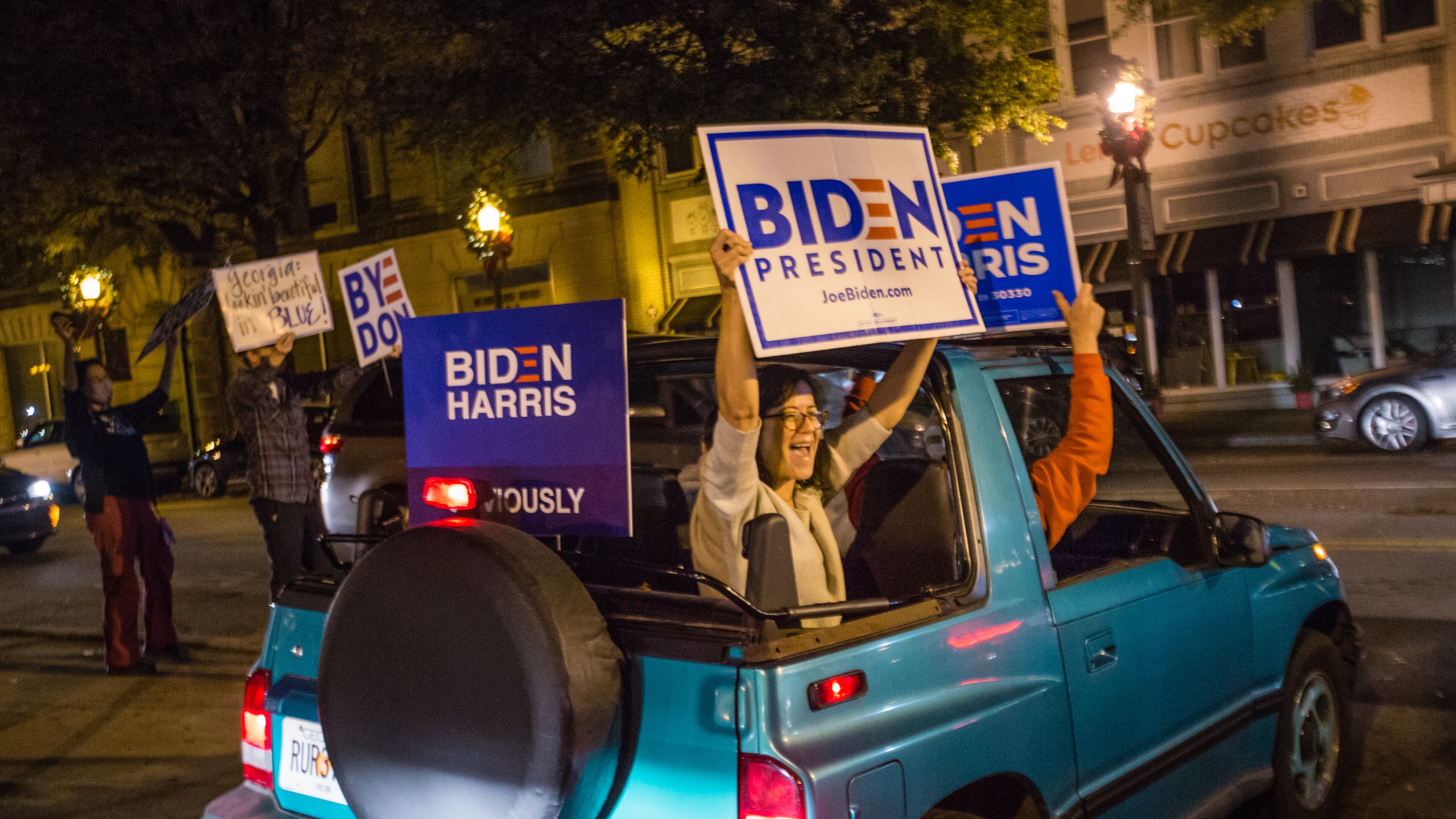 Biden supporters along W Ponce de Leon Ave in Decatur as elections results become more clear and celebrations of President-Elect Joe Biden and VP Kamala Harris take place all over Atlanta on Saturday, Nov 7, 2020. (Jenni Girtman for The Atlanta Journal-Constitution)
