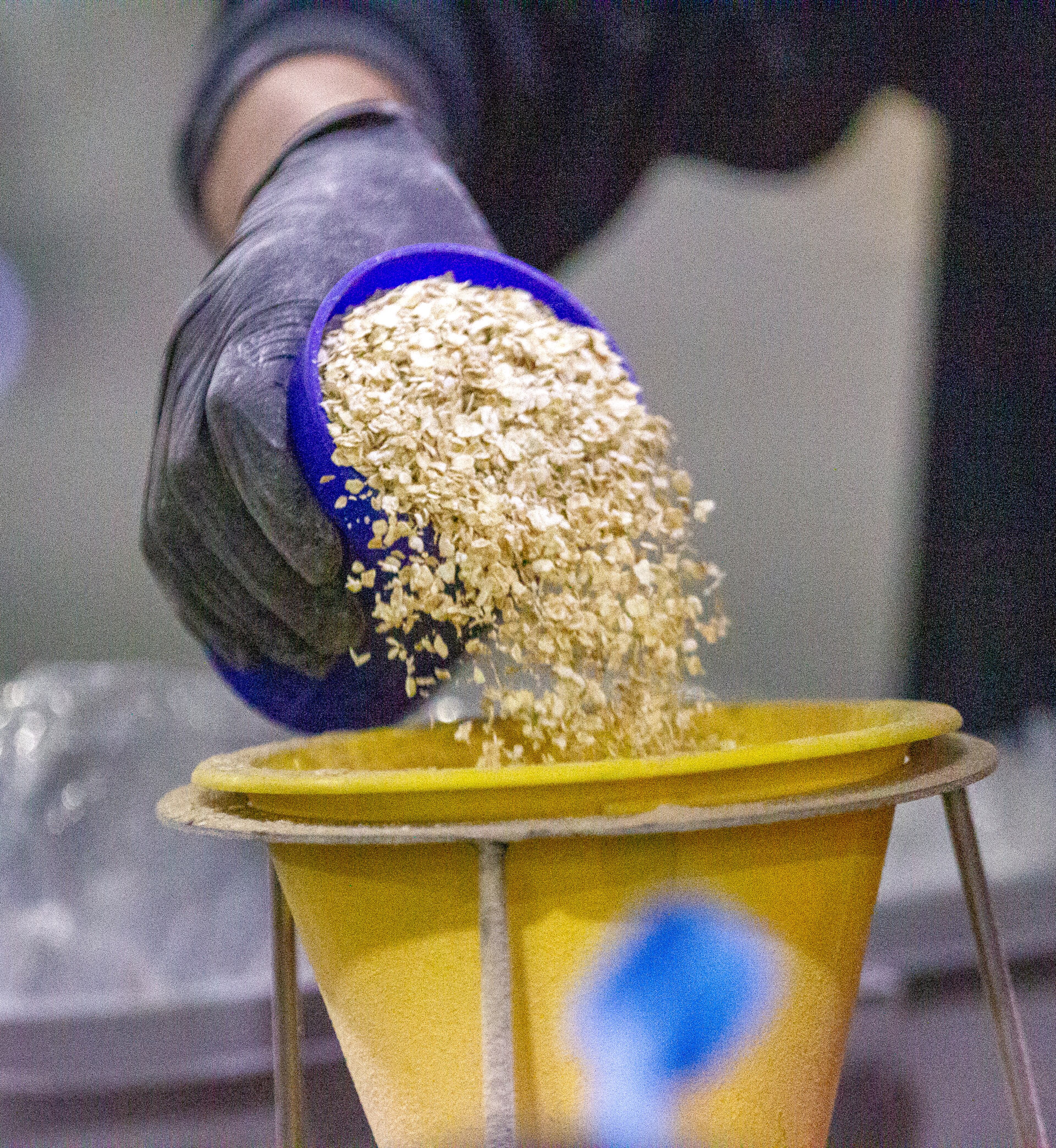 A volunteer measures out a precise amount of oatmeal for each meal during the 9/11 National Day of Service at the Georgia World Congress Center on Saturday, September 11, 2021. During the event, hundreds of volunteers packed meals for the Atlanta Community Food Bank. STEVE SCHAEFER FOR THE ATLANTA JOURNAL-CONSTITUTION