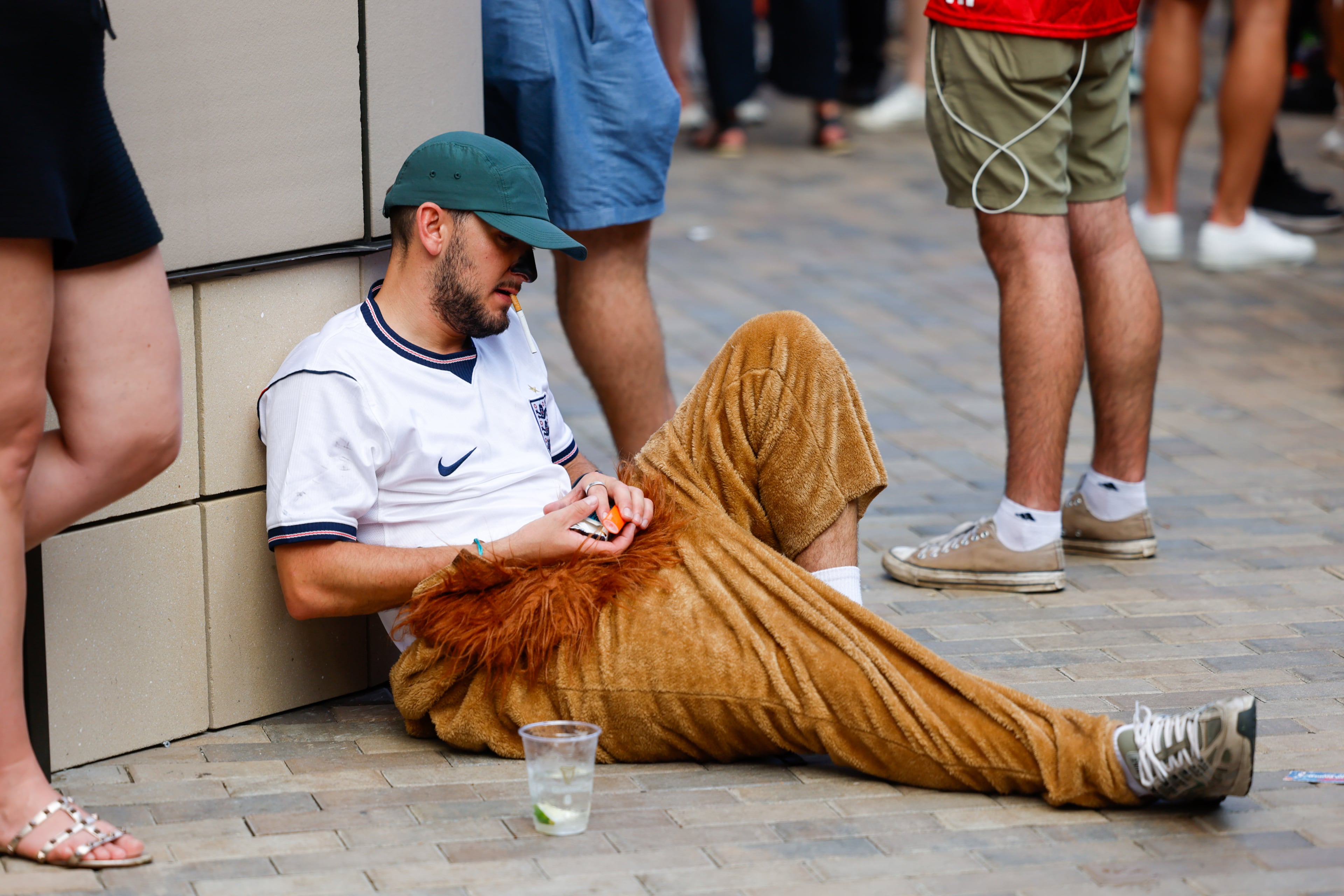 An England fan takes a smoke break at Irish Exit after Argentina wins the FIFA World Cup game between England and Argentina in Atlanta on July 15, 2026. It’s the last game Atlanta is hosting. Argentina won 2-1. (Arvin Temkar/AJC)