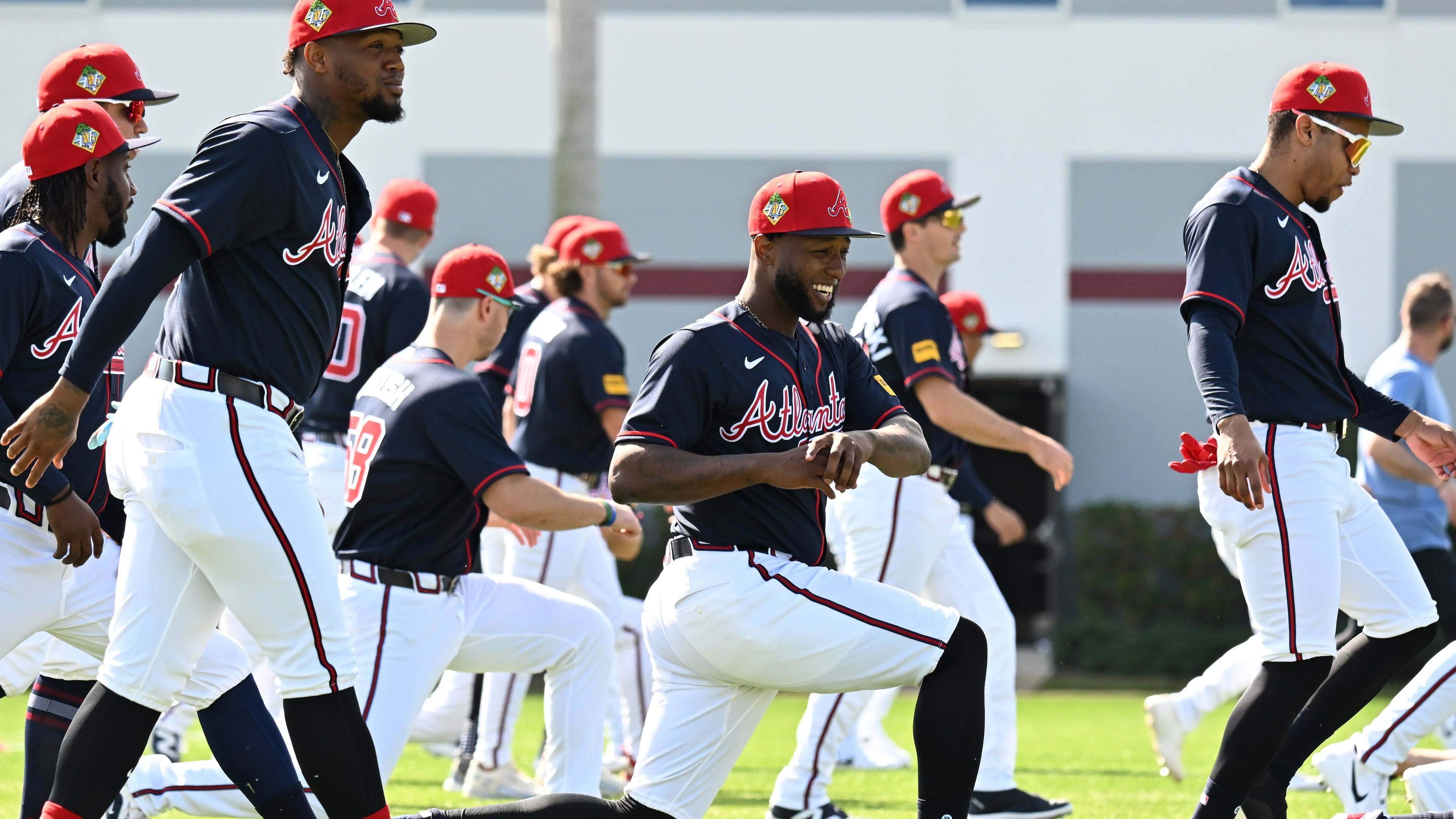 Atlanta Braves outfielder Jurickson Profar (center) warms up during the first full-squad spring training workouts at CoolToday Park, Sunday, Feb. 15, 2026, in North Port, Fla. (Hyosub Shin/AJC)