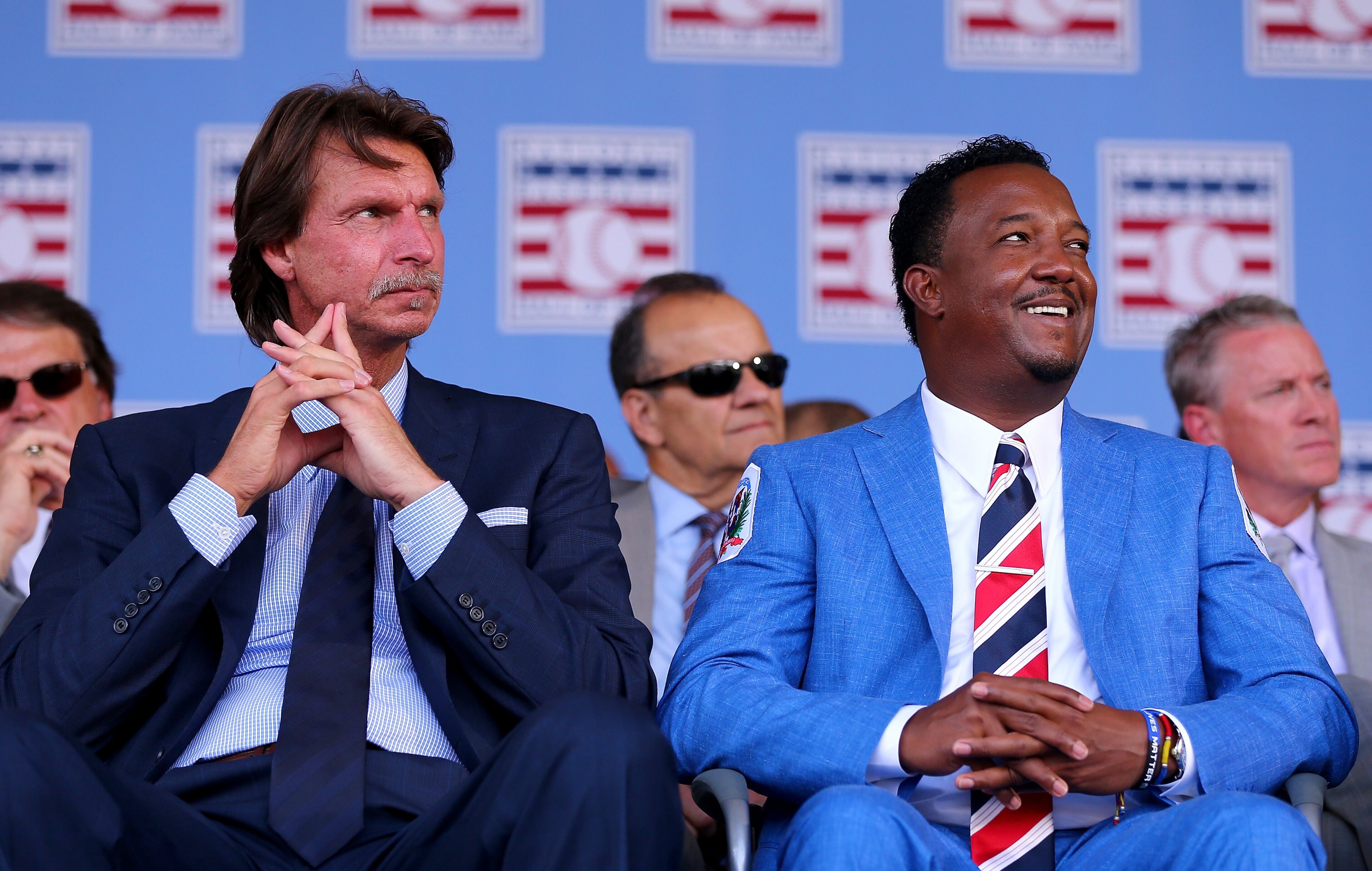 COOPERSTOWN, NY - JULY 26: Randy Johnson and Pedro Martinez sit as the Hall of Fame Induction Ceremony begins at National Baseball Hall of Fame on July 26, 2015 in Cooperstown, New York. Johnson was inducted with Pedro Martinez,Craig Biggio and John Smoltz (Photo by Elsa/Getty Images)