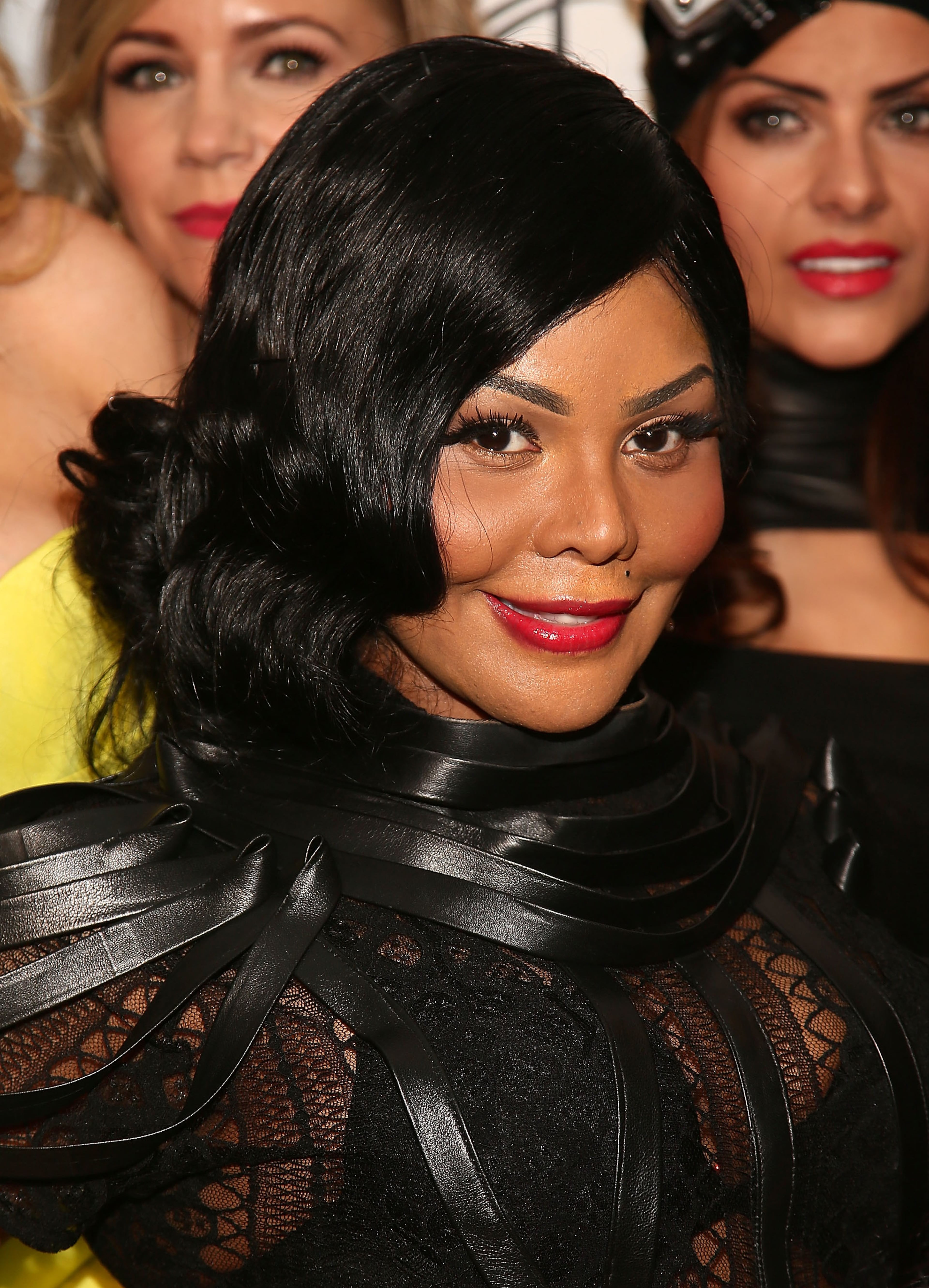 NEW YORK, NY - FEBRUARY 09: Rapper Lil' Kim poses for photos backstage at the Reality of FASHION the Reality of AIDS fall 2013 fashion show during Mercedes-Benz Fashion Week at the Altman Building on February 9, 2013 in New York City. (Photo by Astrid Stawiarz/Getty Images)