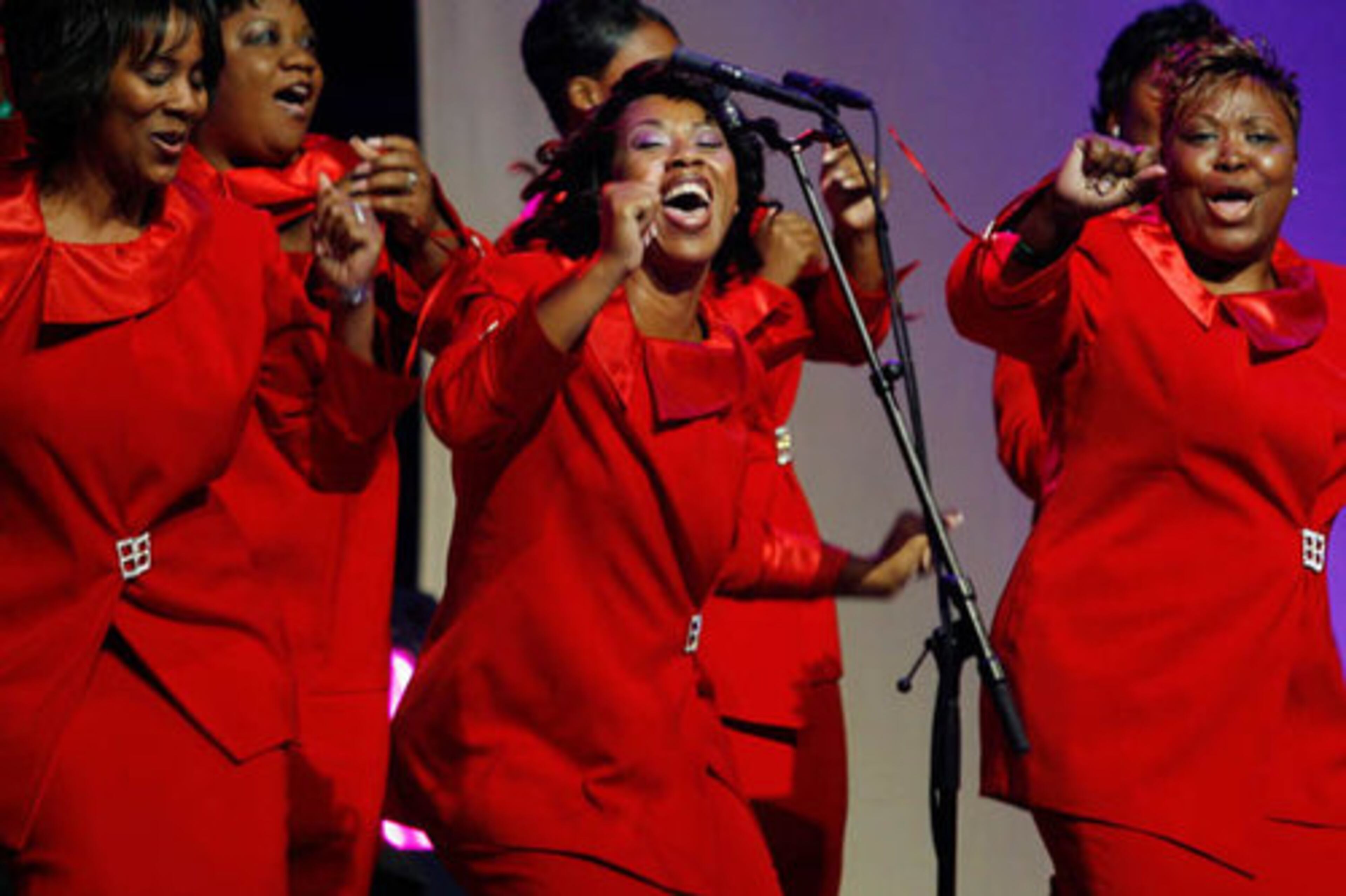 LaShaundra Weathersby, center, and the Enon Church choir move with the lyrics.