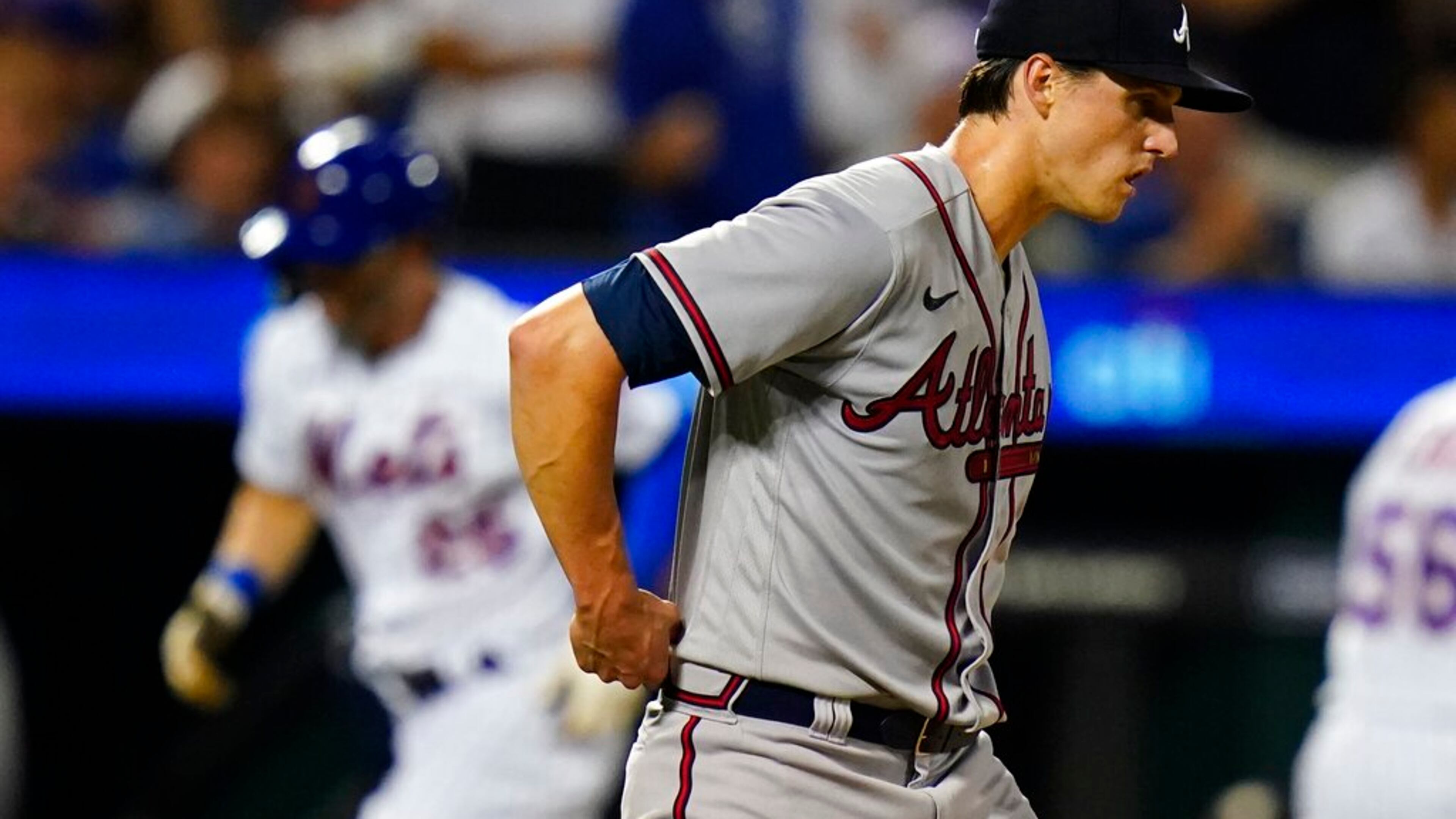 Atlanta Braves starting pitcher Kyle Wright waits as New York Mets' Tyler Naquin runs the bases after hitting a home run during the sixth inning of a baseball game Thursday, Aug. 4, 2022, in New York. (AP Photo/Frank Franklin II)