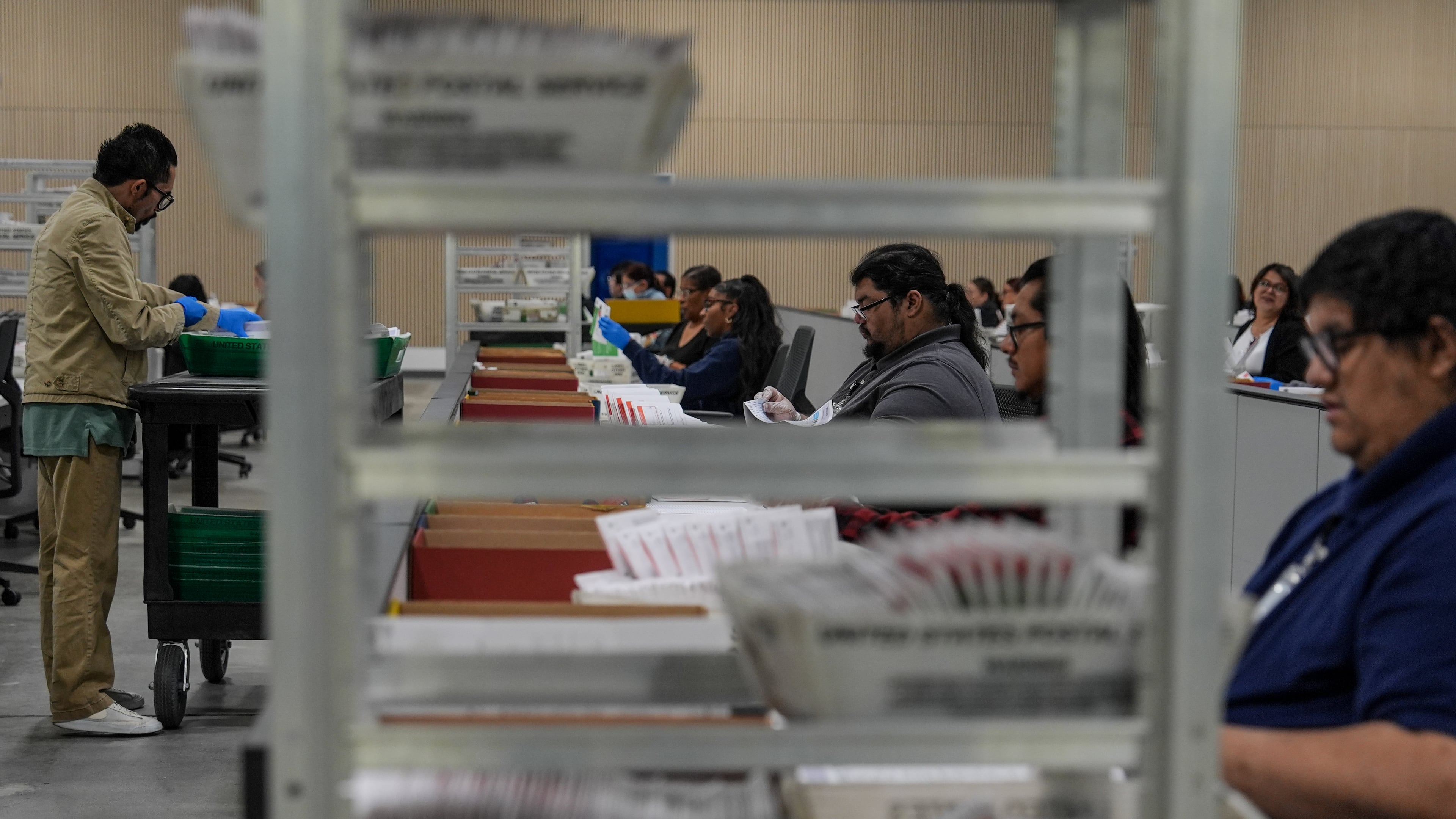 Ballots are inspected the day after California's primary election at the Los Angeles County Ballot Processing Center Wednesday, June 3, 2026, in City of Industry, Calif. (AP Photo/Jae C. Hong)