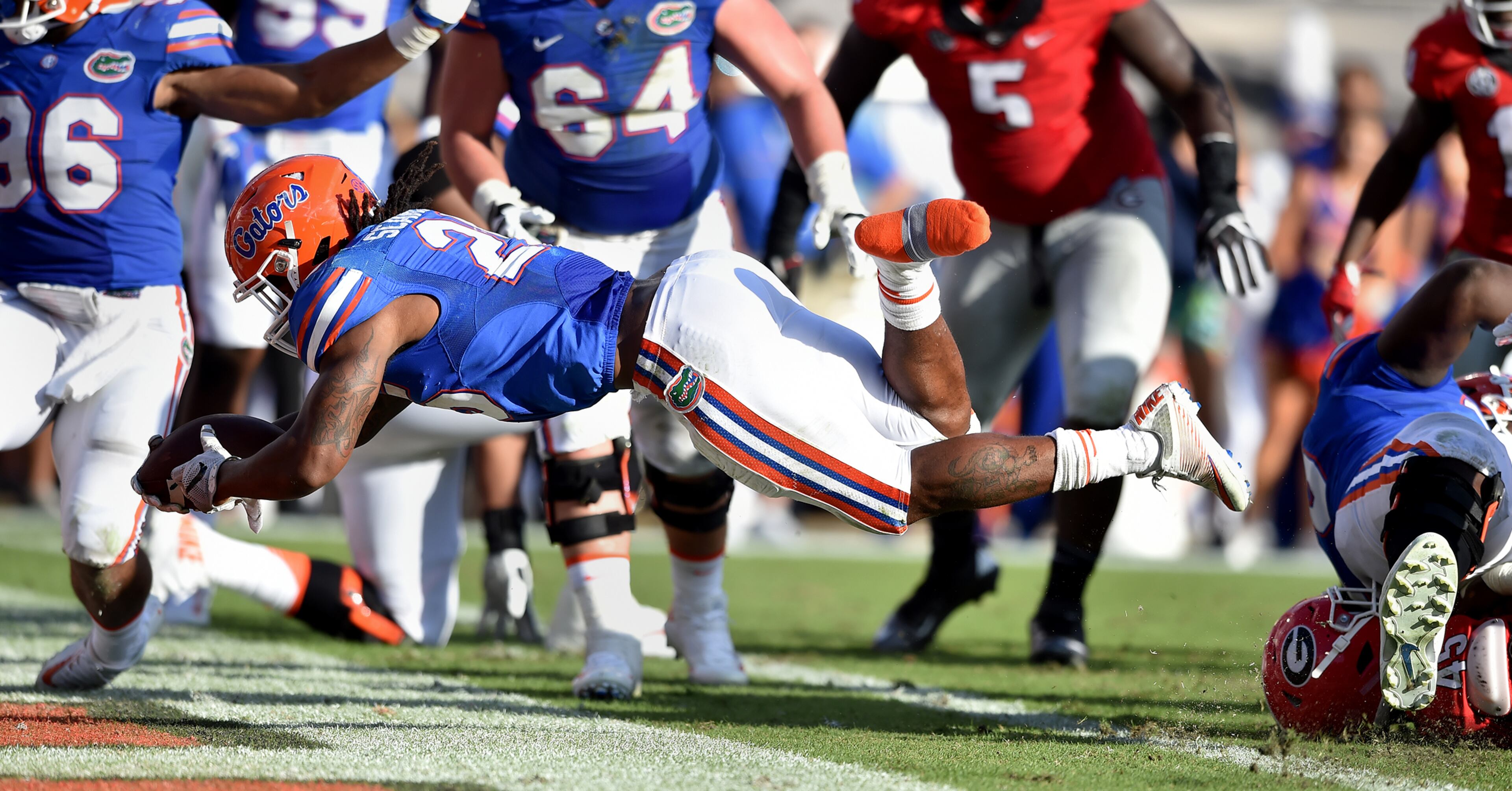 October 29 Jacksonville, FL : Florida Gators running back Jordan Scarlett scores in the second quarter against the Georgia Bulldogs at EverBank Field in Jacksonville Saturday October 29, 2016. BRANT SANDERLIN/BSANDERLIN@AJC.COM
