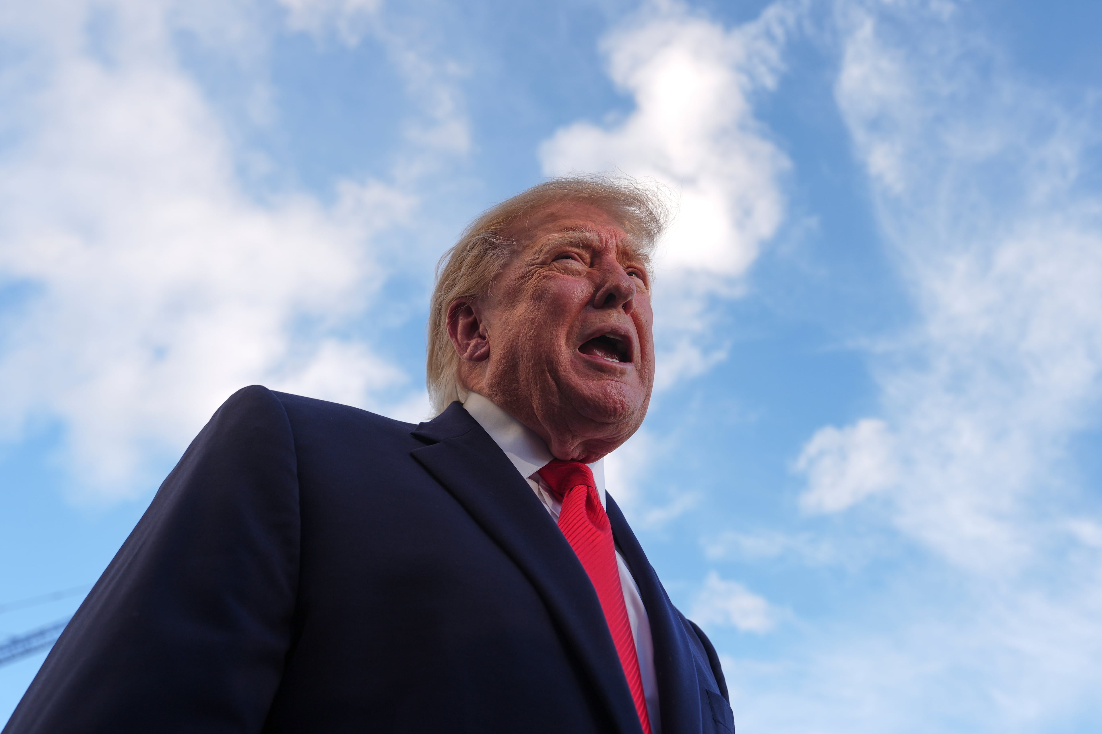 President Donald Trump speaks with reporters before walking to board Marine One on the South Lawn of the White House on Monday. (Julia Demaree Nikhinson/AP)