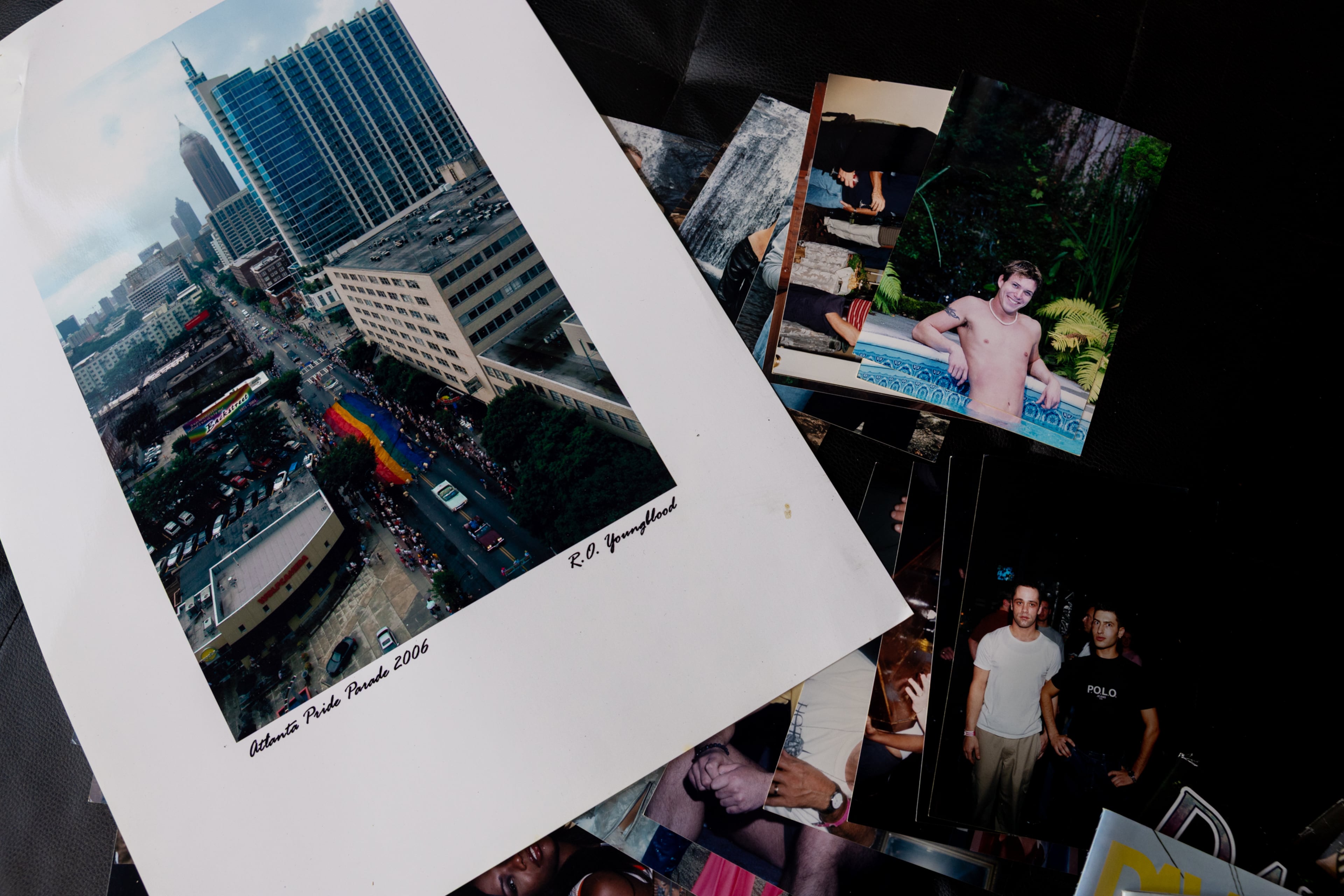 Photographer Russ Youngblood, who has documented the gay community for decades, lays out magazine covers he’s photographed at his home in Atlanta on Oct. 8, 2026. (Arvin Temkar/AJC)