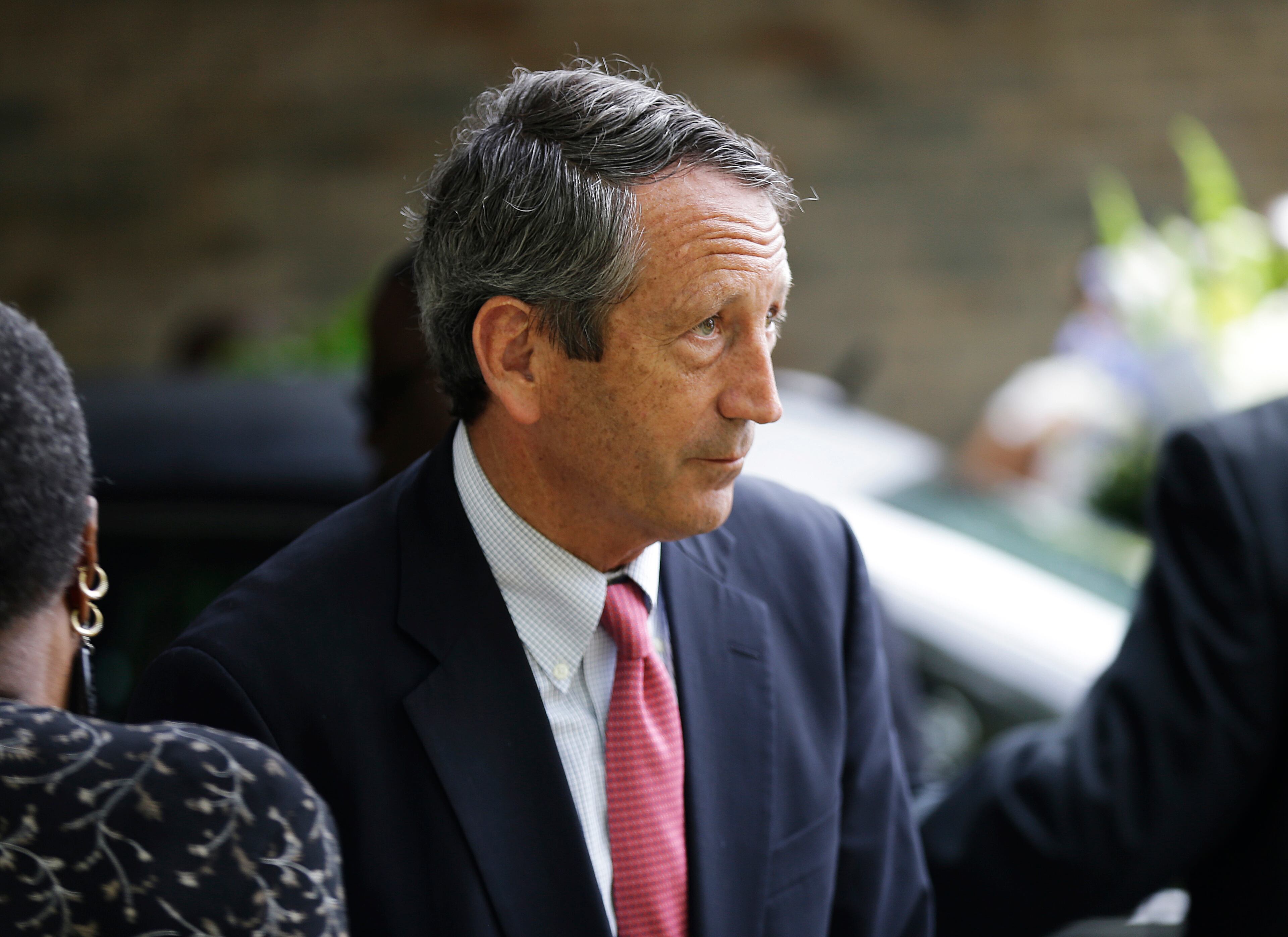 Rep. Mark Sanford, R-S.C., leaves the funeral for Walter Scott in Summerville, S.C. on Saturday, April 11, 2015. Scott was fatally shot a week earlier by a North Charleston police officer after a traffic stop. Officer Michael Slager has been charged with murder. (AP Photo/David Goldman)
