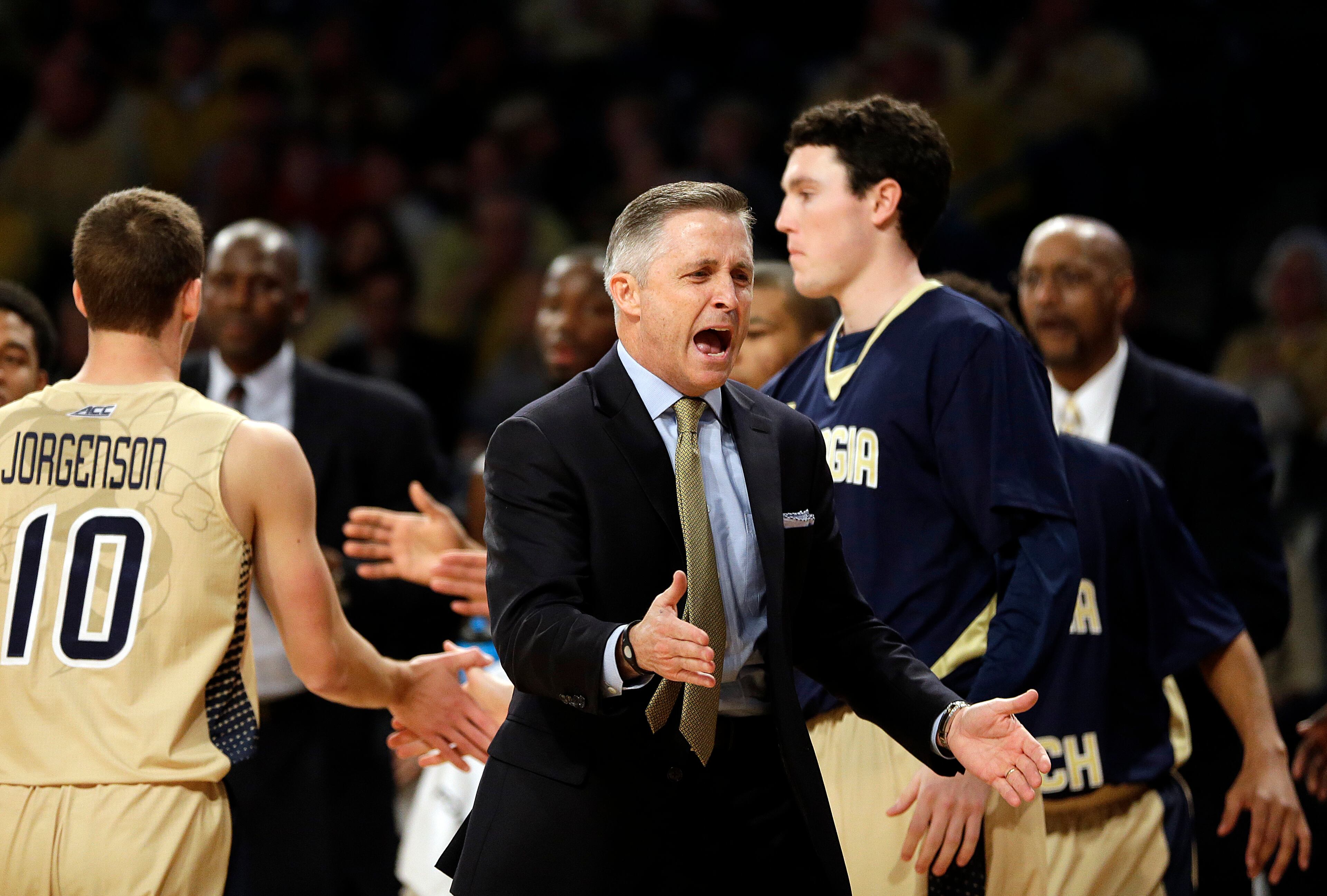 Georgia Tech head coach Brian Gregory cheers in the first half of an NCAA college basketball game against Georgia, Friday, Nov. 14, 2014, in Atlanta. (AP Photo/David Goldman)