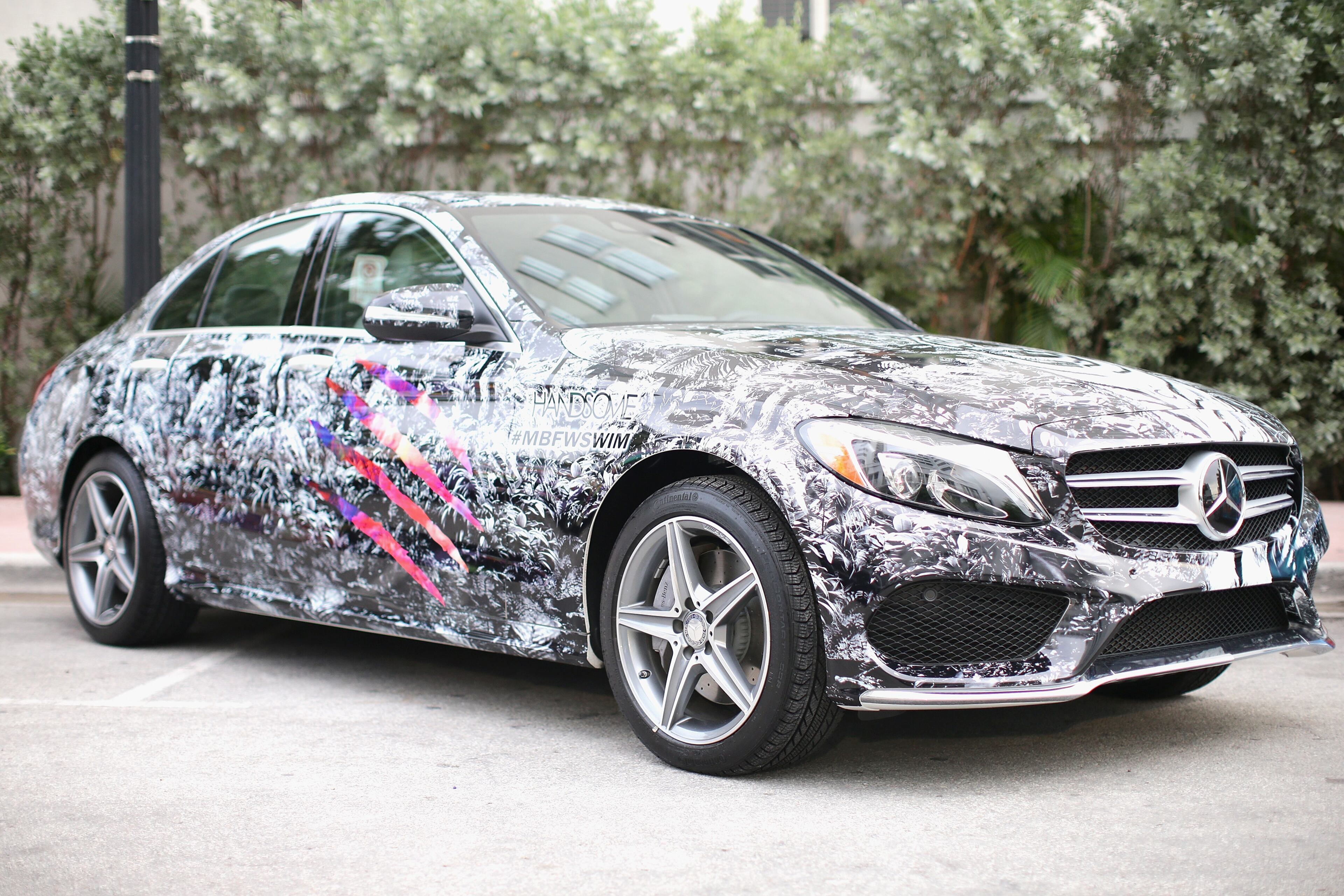 MIAMI BEACH, FL - JULY 17: A 2015 Mercedes-Benz C-Class featuring an exclusive design by Handsome on display during Mercedes-Benz Fashion Week Swim 2015 at The Raleigh on July 17, 2014 in Miami Beach, Florida. (Photo by Neilson Barnard/Getty Images for Mercedes-Benz Fashion Week )